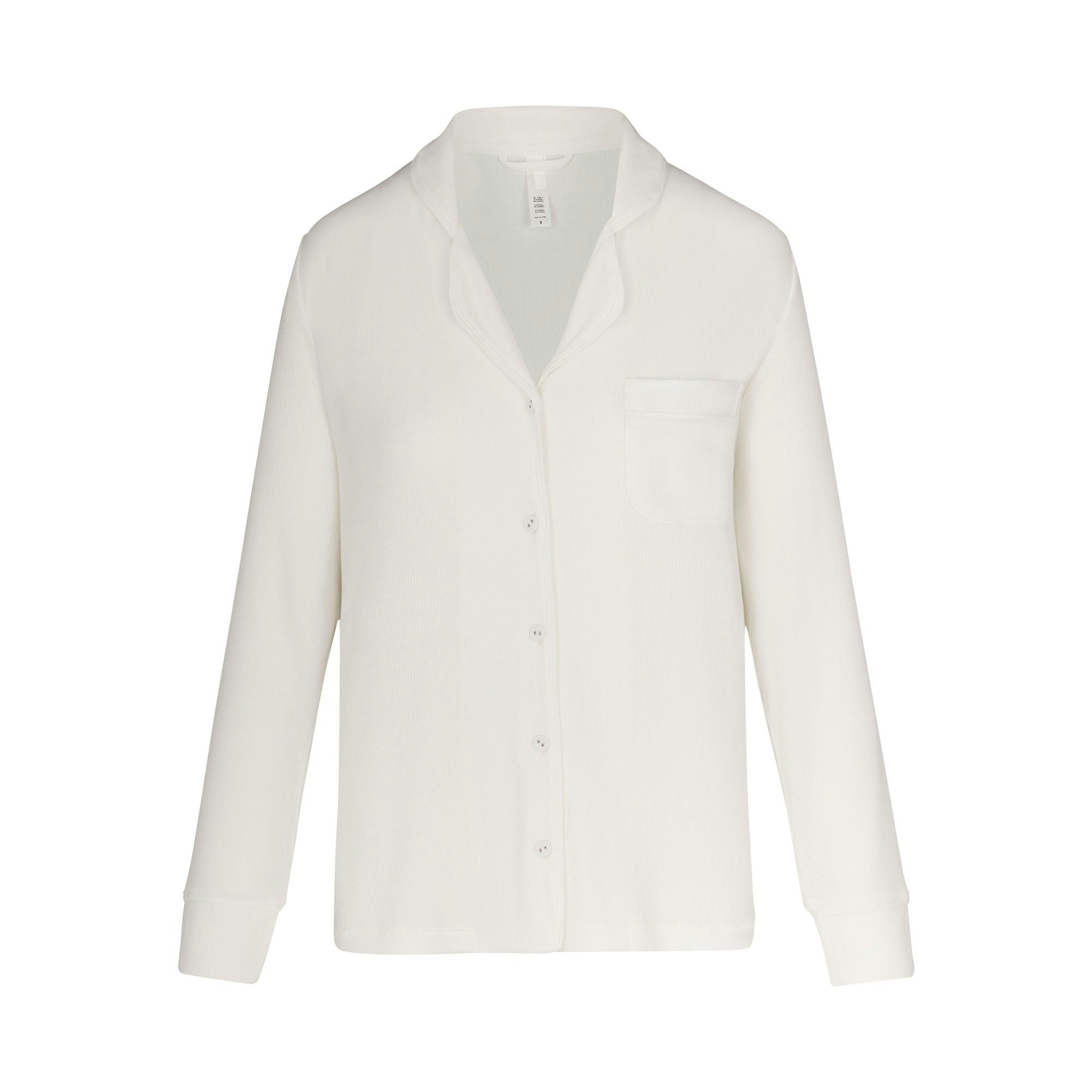 SOFT LOUNGE SLEEP SET LAYS FLAT ON A WHITE BACKGROUND | FLT