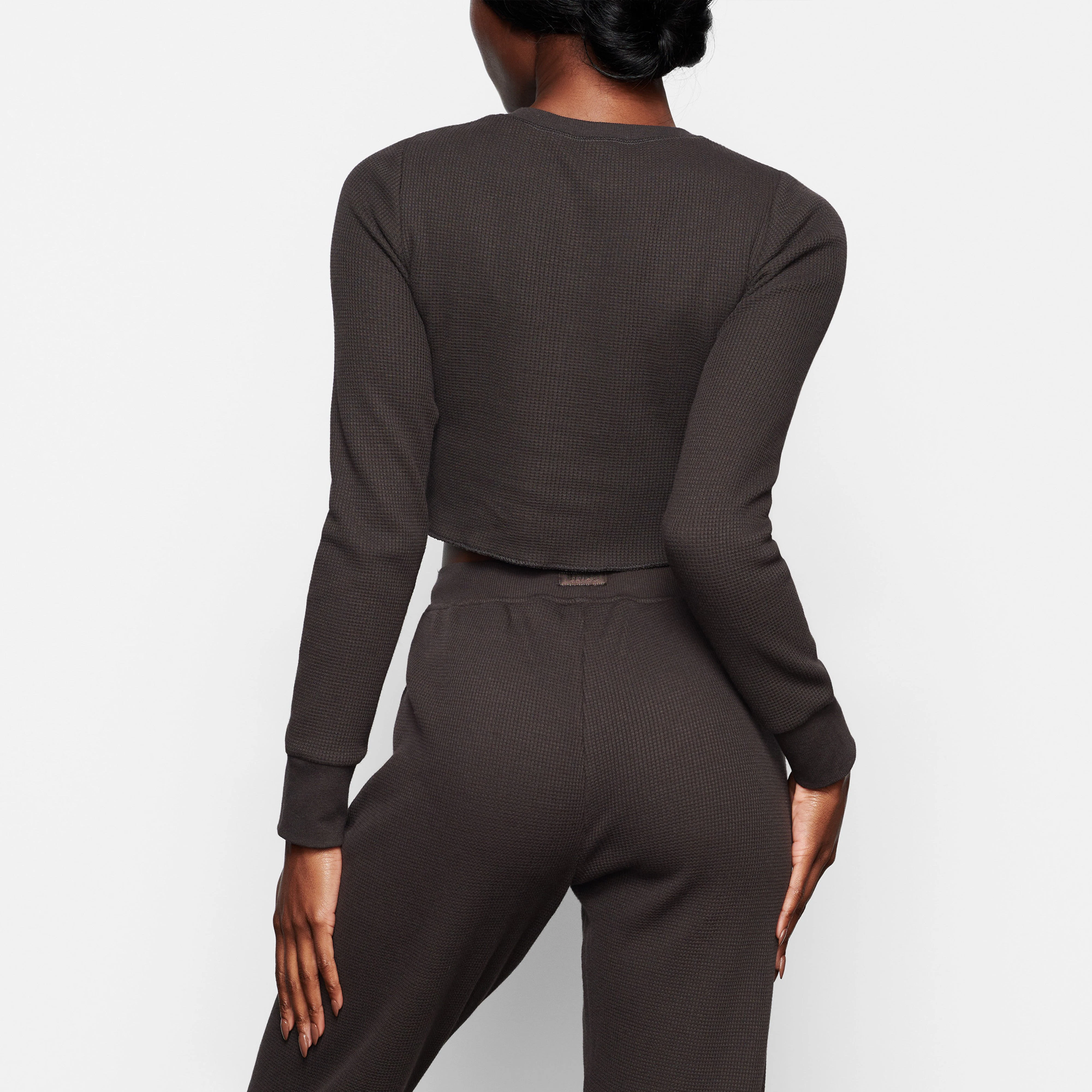 WAFFLE LONG SLEEVE CROP HENLEY ON A MODEL