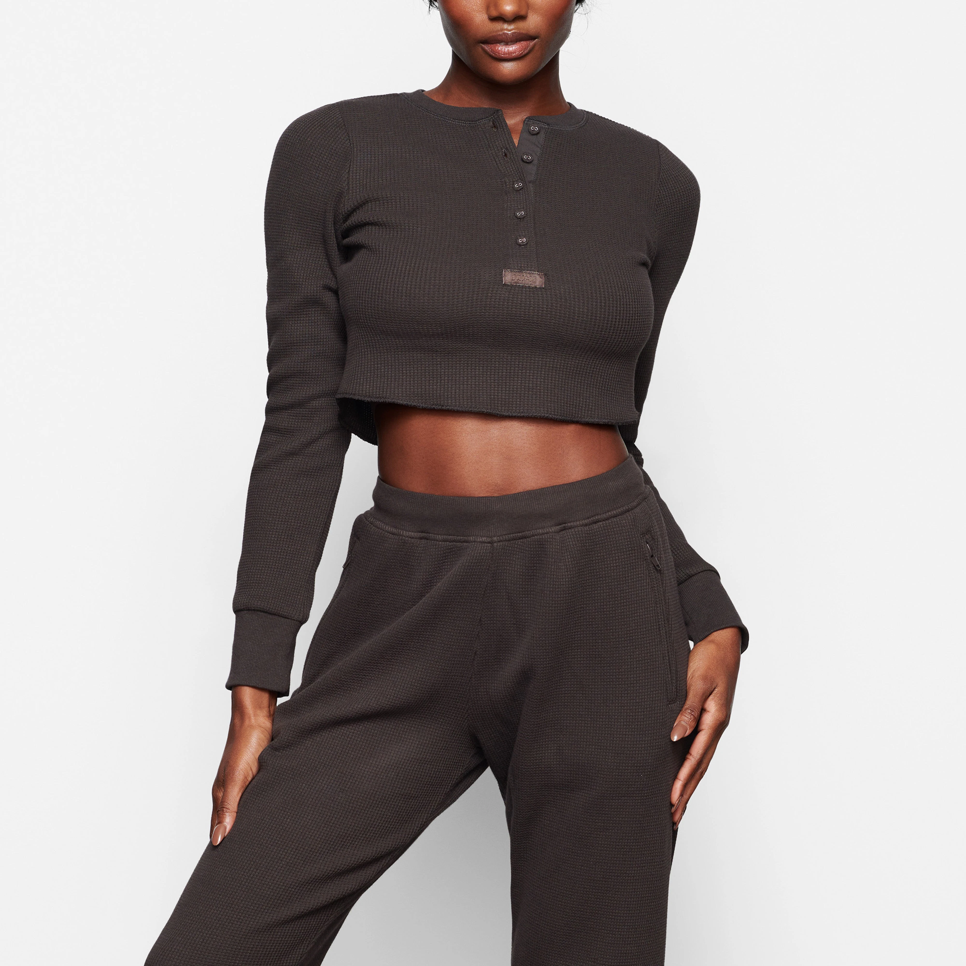 WAFFLE LONG SLEEVE CROP HENLEY ON A MODEL