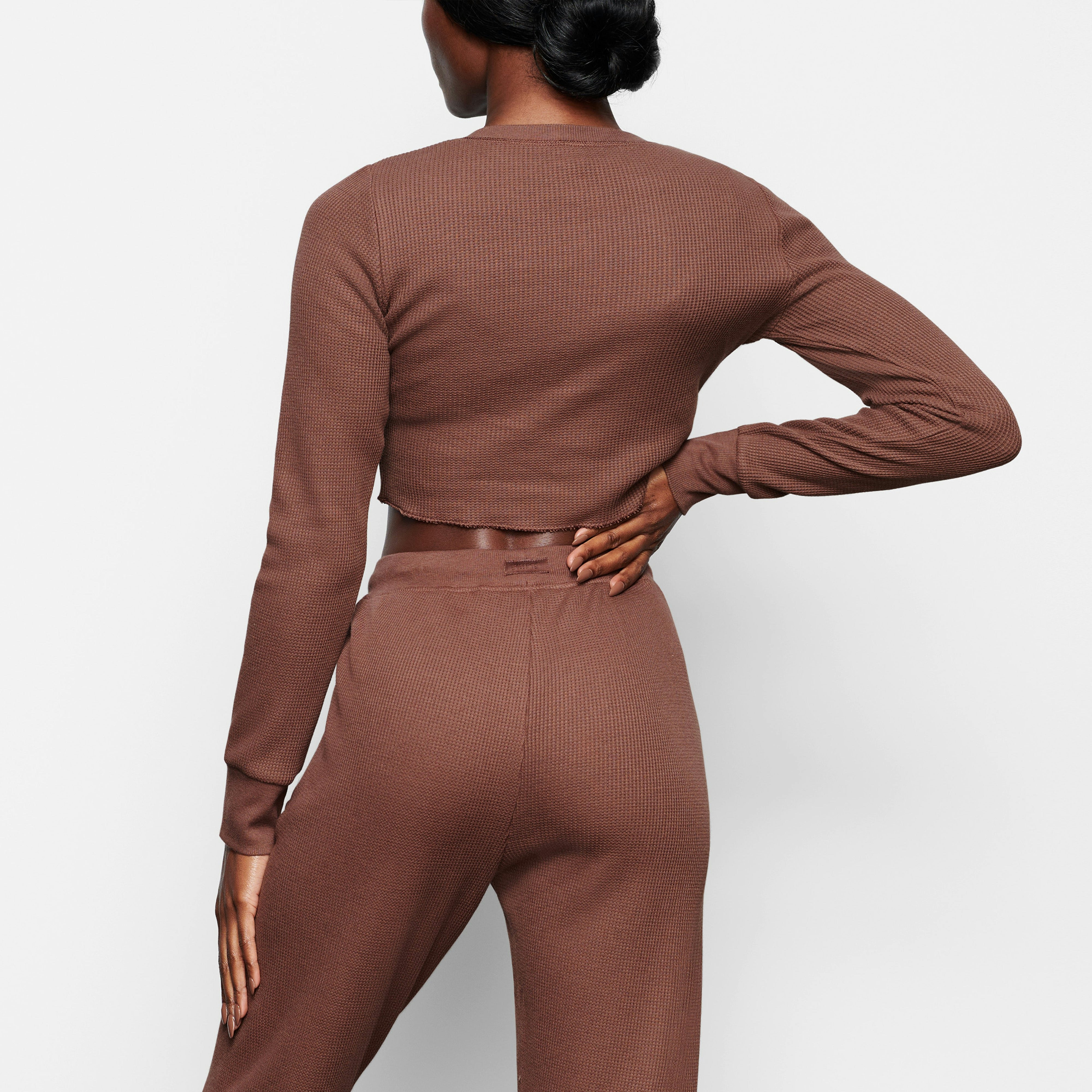 WAFFLE LONG SLEEVE CROP HENLEY ON A MODEL