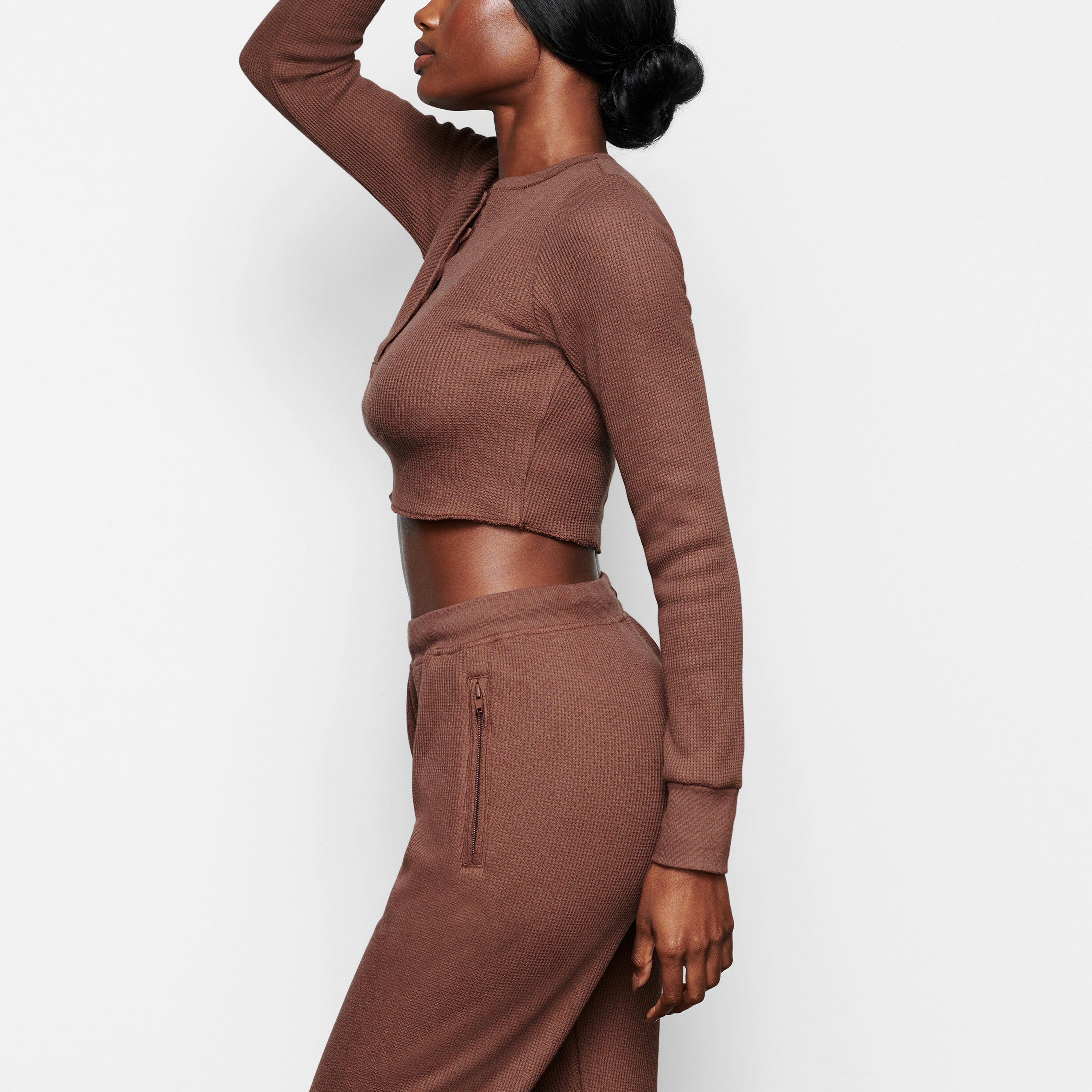 WAFFLE LONG SLEEVE CROP HENLEY ON A MODEL