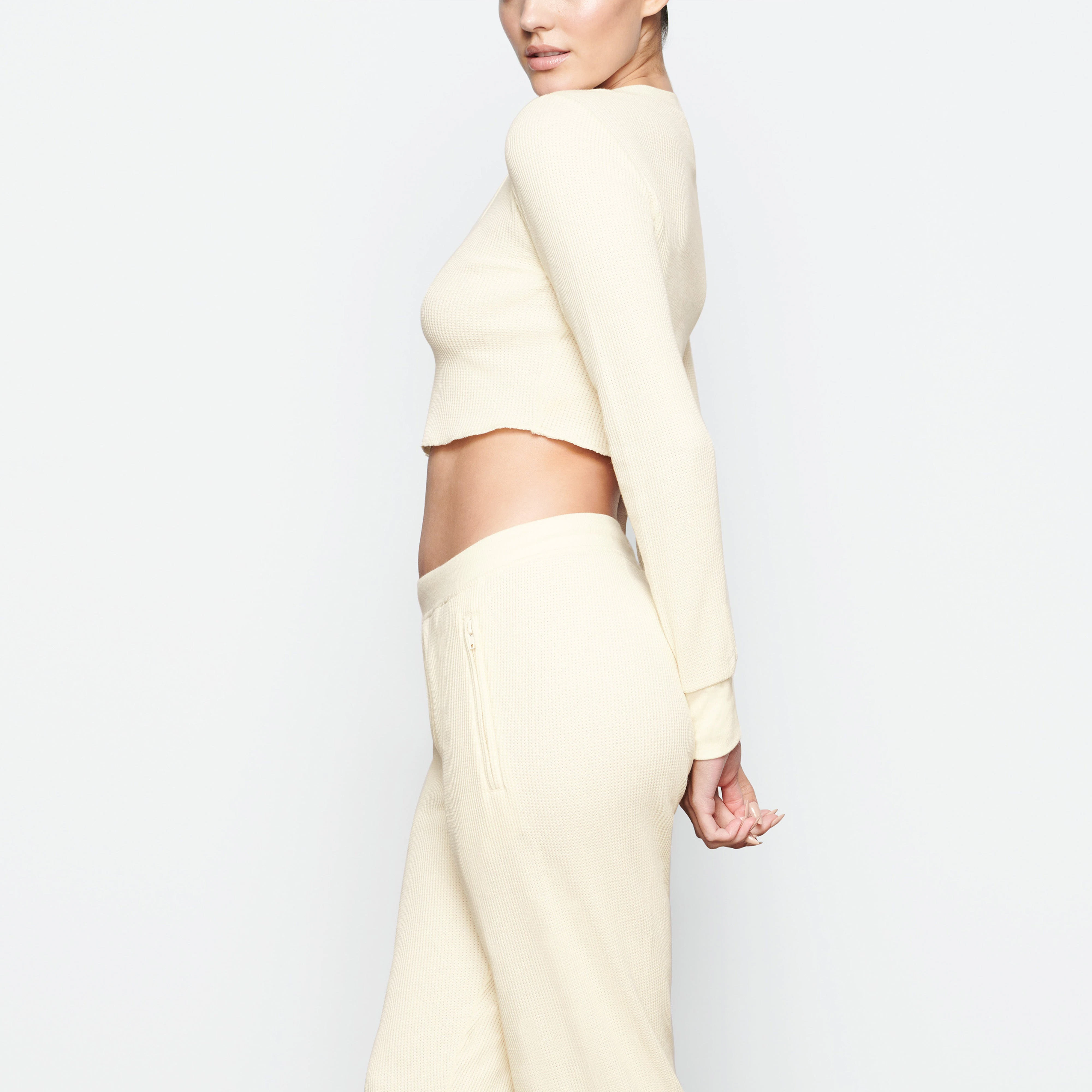 WAFFLE LONG SLEEVE CROP HENLEY ON A MODEL