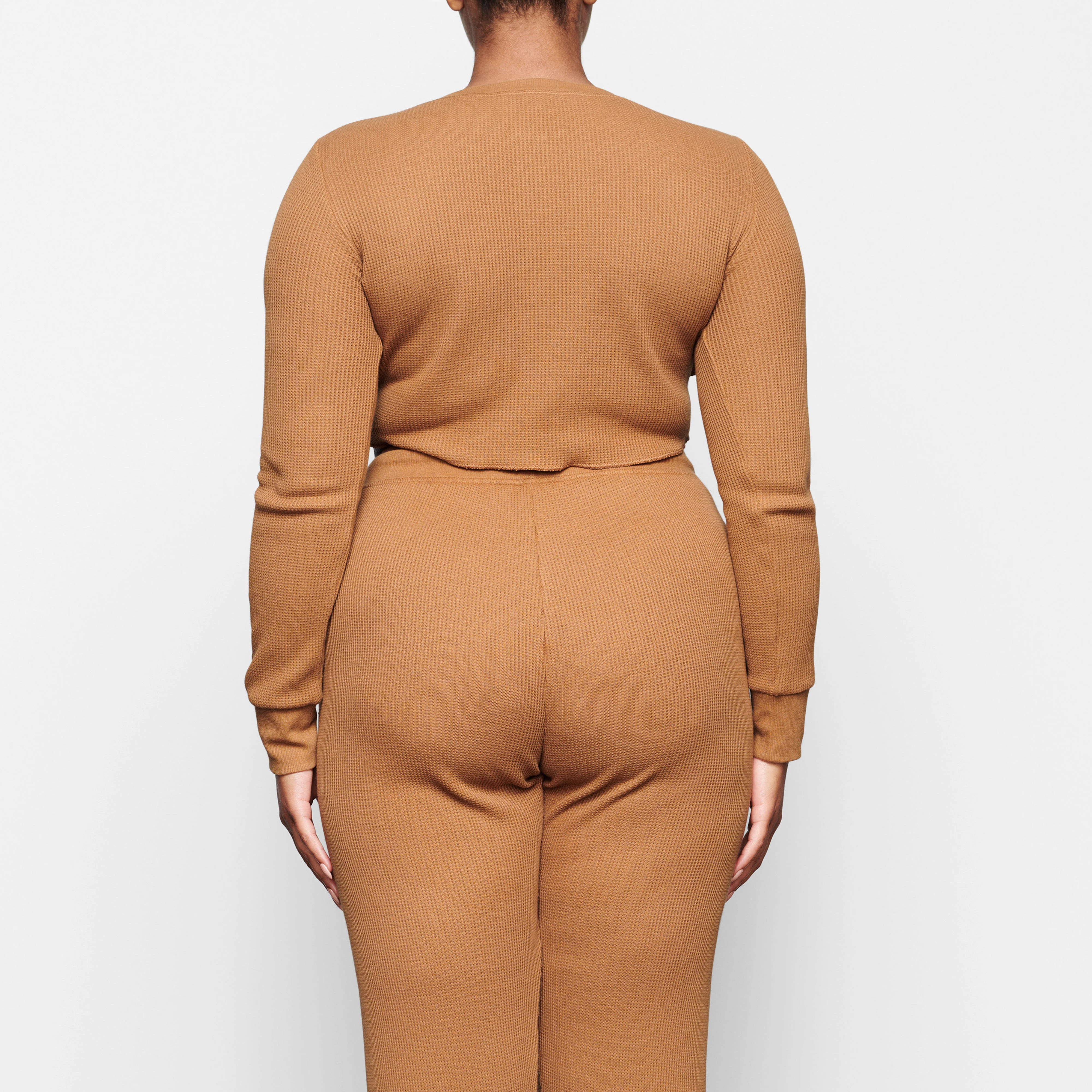 WAFFLE LONG SLEEVE CROP HENLEY ON A MODEL