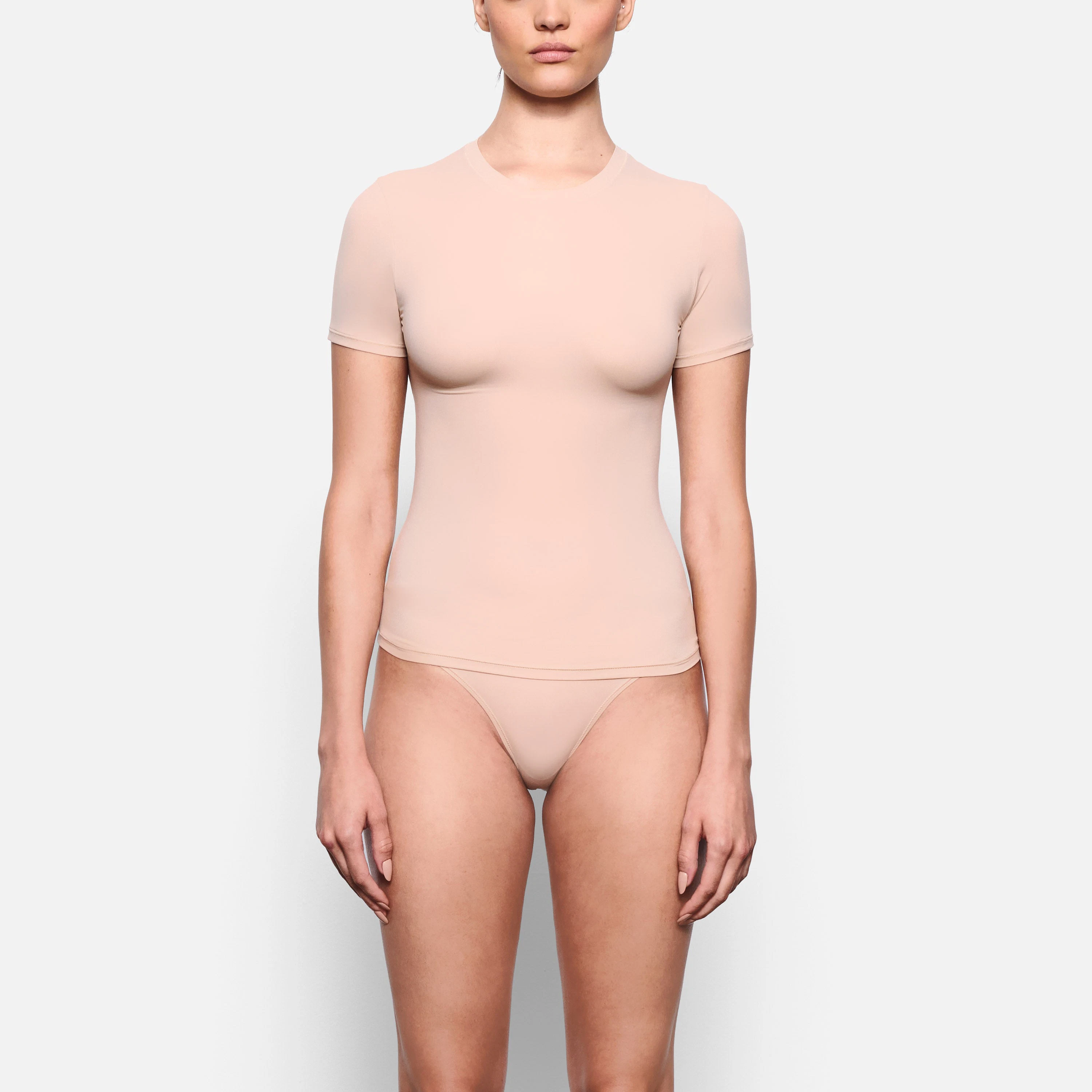 FRONT VIEW OF THE FITS EVERYBODY SHORT SLEEVE T-SHIRT ON A MODEL