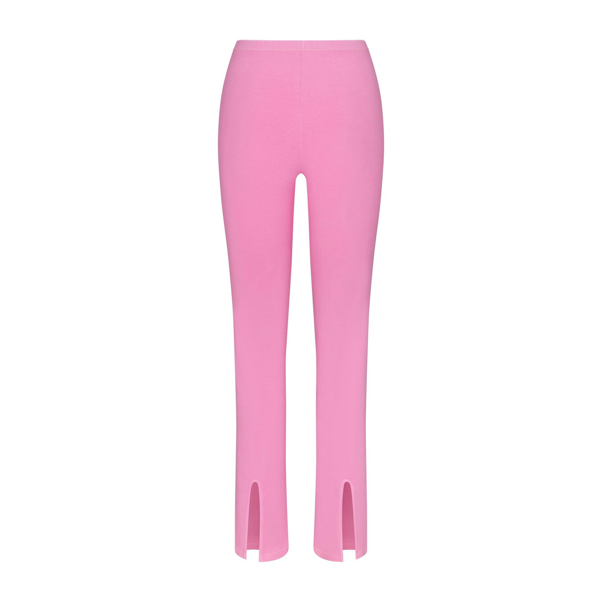 OUTDOOR SPLIT HEM LEGGING LAYS FLAT ON A WHITE BACKGROUND