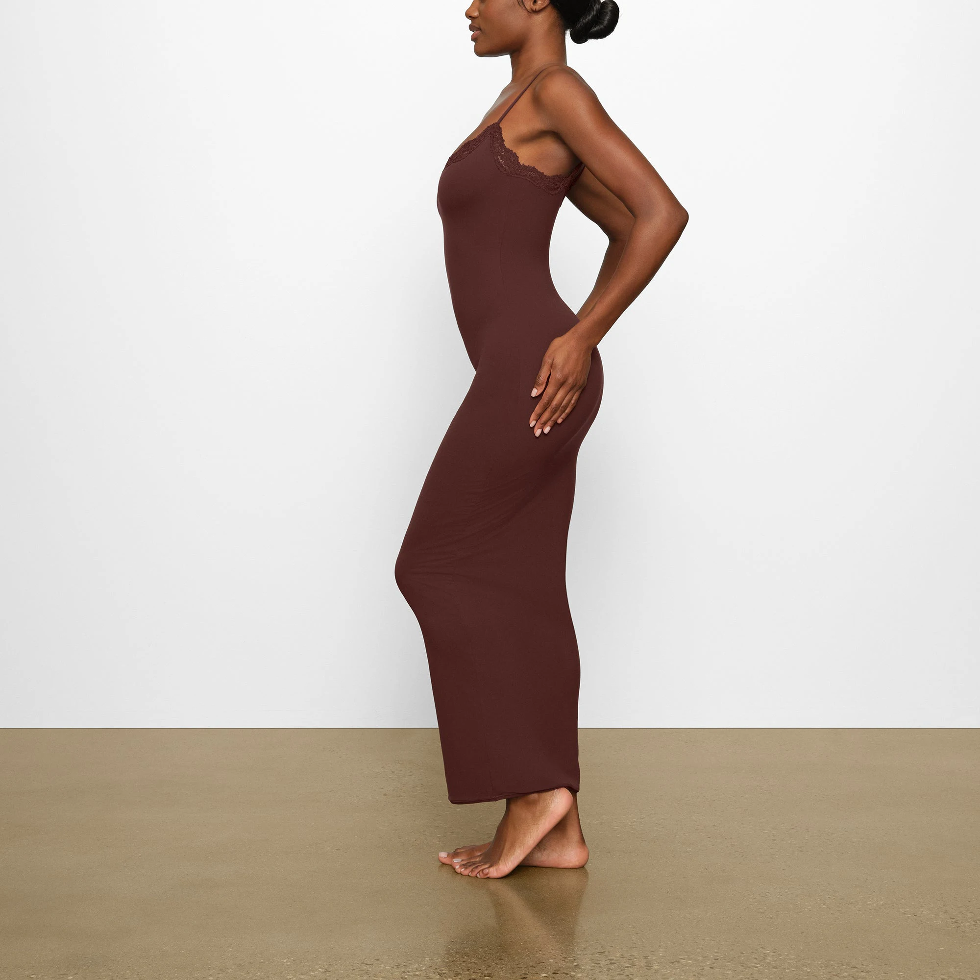 FITS EVERYBODY LACE LONG SLIP DRESS WORN BY A MODEL IN SIDE VIEW