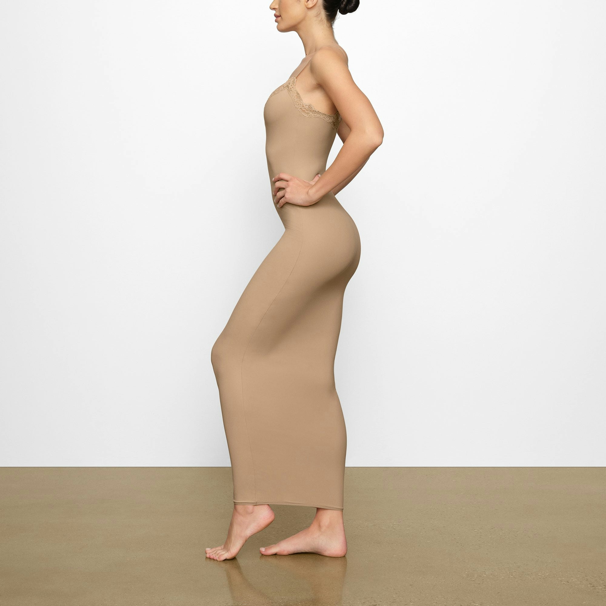 FITS EVERYBODY LACE LONG SLIP DRESS WORN BY A MODEL IN SIDE VIEW