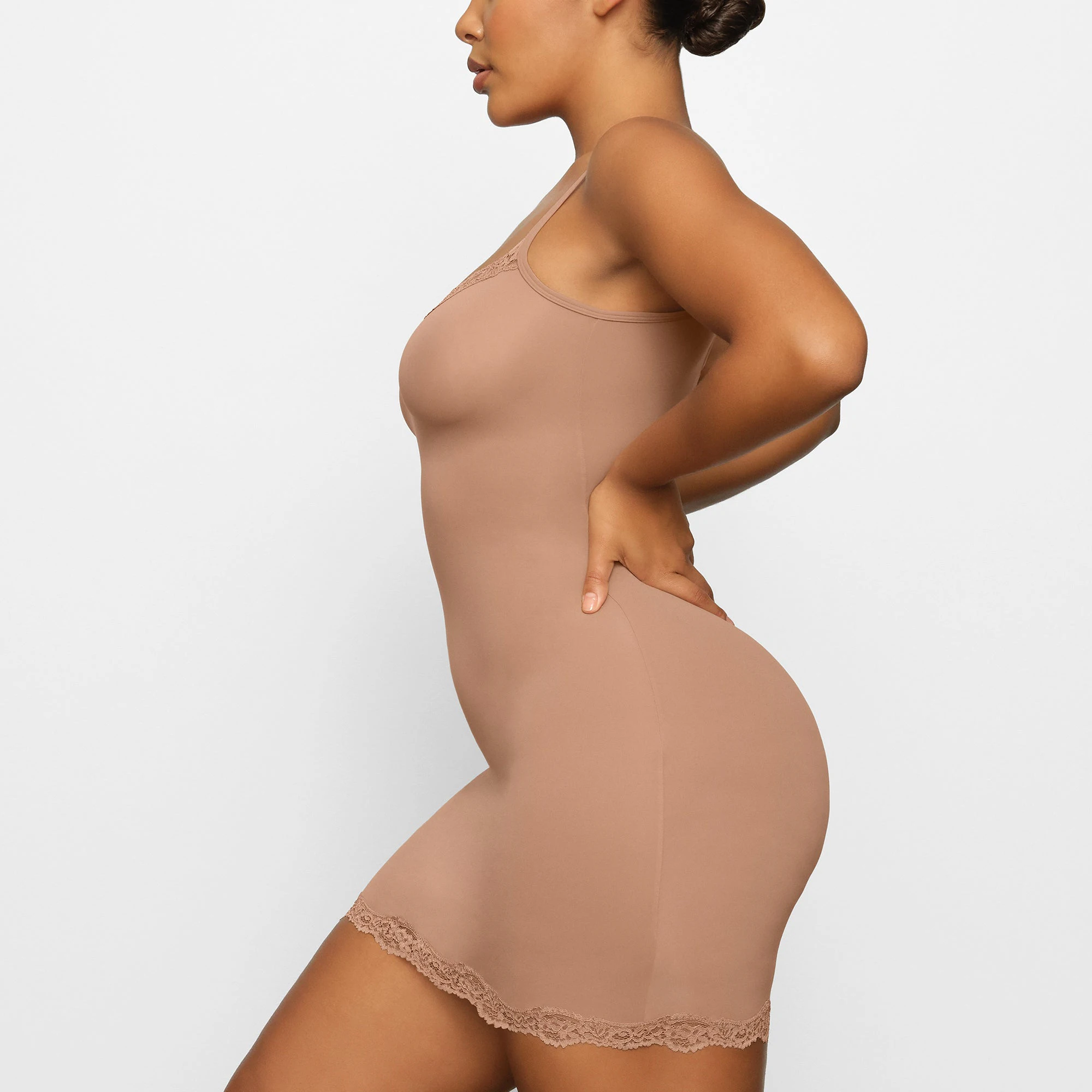 FITS EVERYBODY LACE SLIP DRESS WORN BY A MODEL IN SIDE VIEW