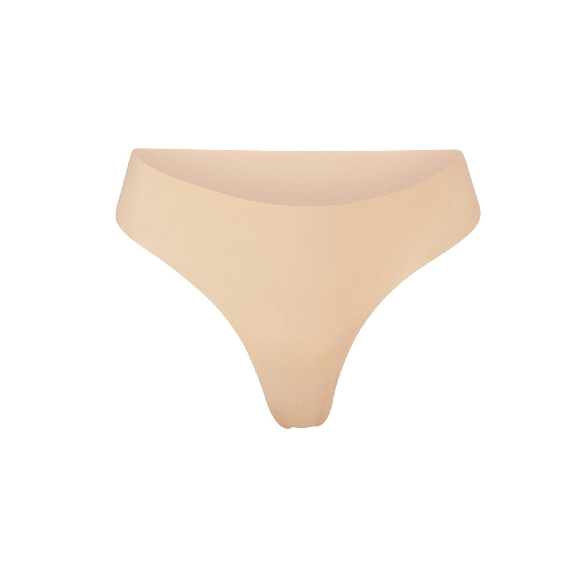 NAKED DIPPED THONG | CLAY (THONGS, PANTIES) LAYS FLAT ON A WHITE BACKGROUND | FLT