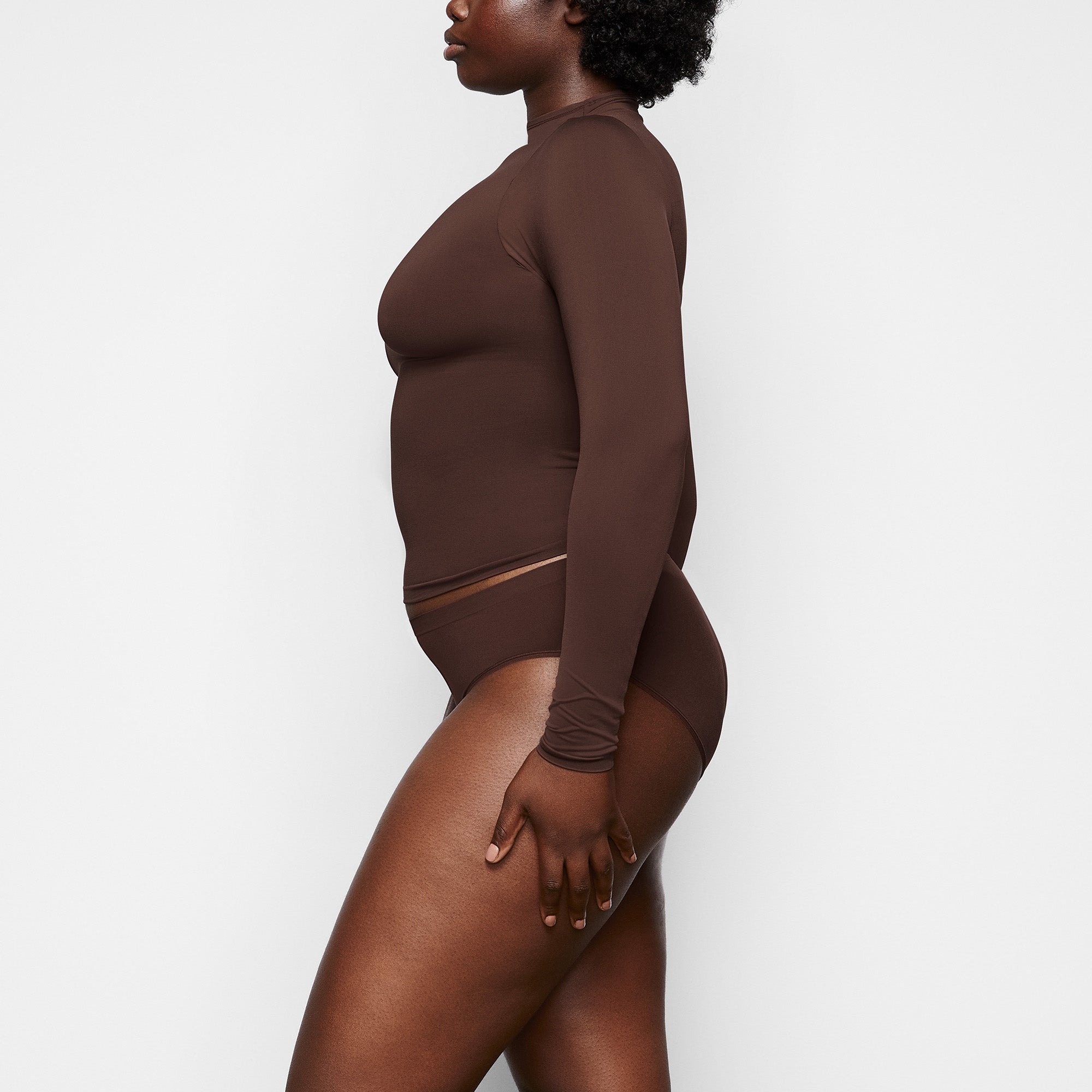 SOFT SMOOTHING BRIEF WORN BY A MODEL IN SIDE VIEW