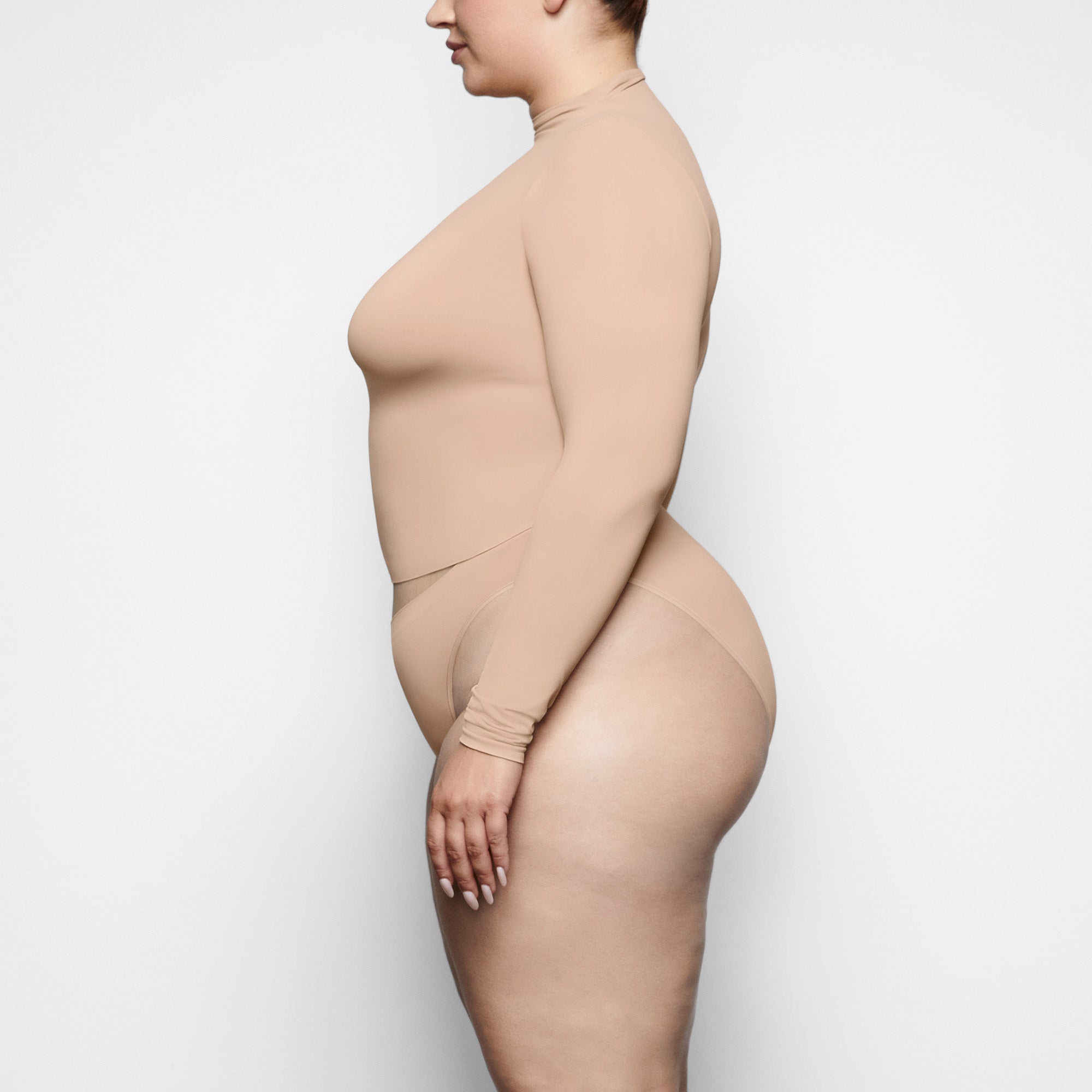 SOFT SMOOTHING BRIEF WORN BY A MODEL IN SIDE VIEW