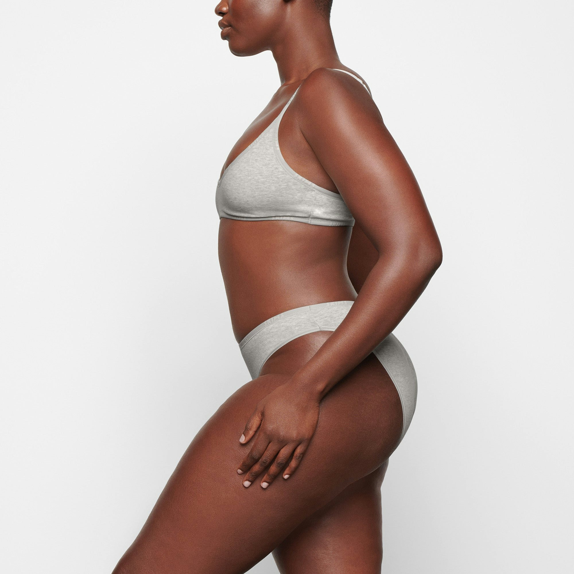 COTTON LOGO HIGH LEG BIKINI WORN BY A MODEL IN SIDE VIEW