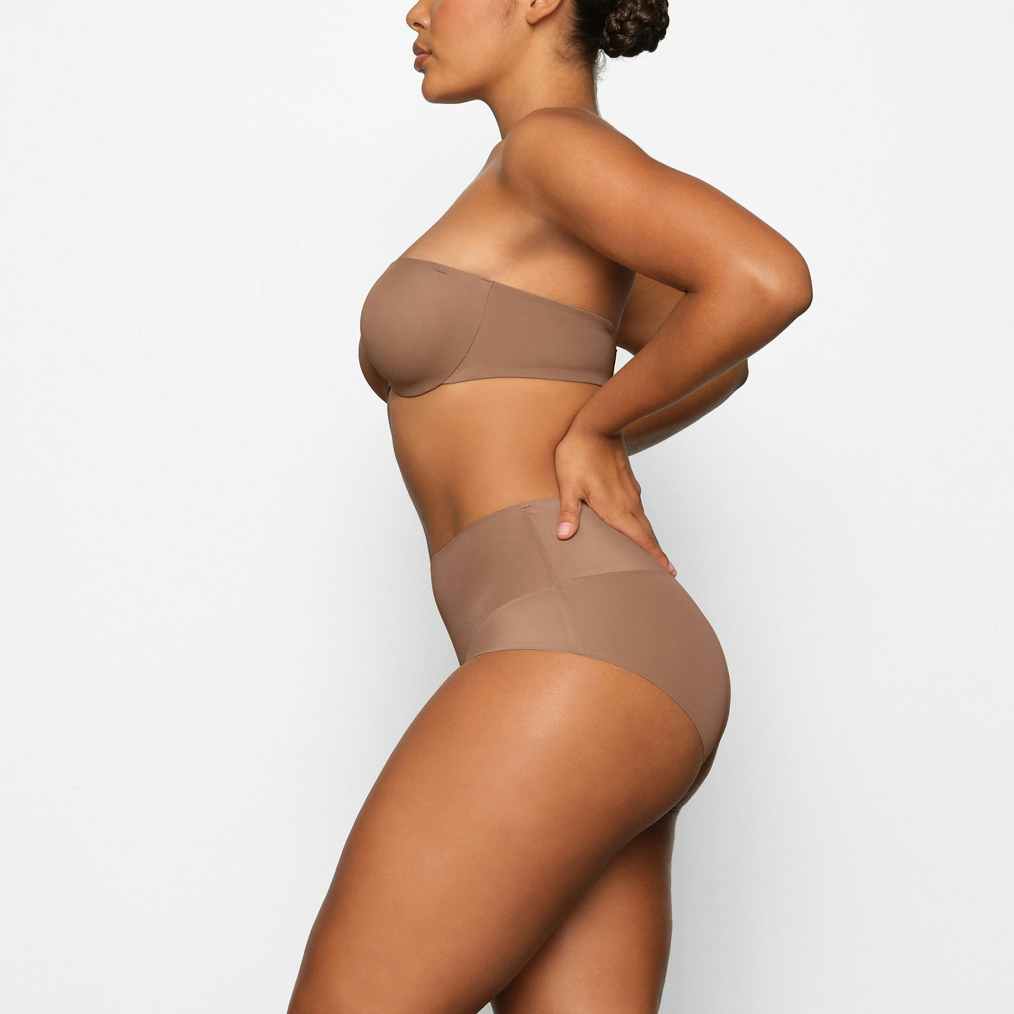 SMOOTHING HIGH WAIST BRIEF WORN BY A MODEL IN SIDE VIEW