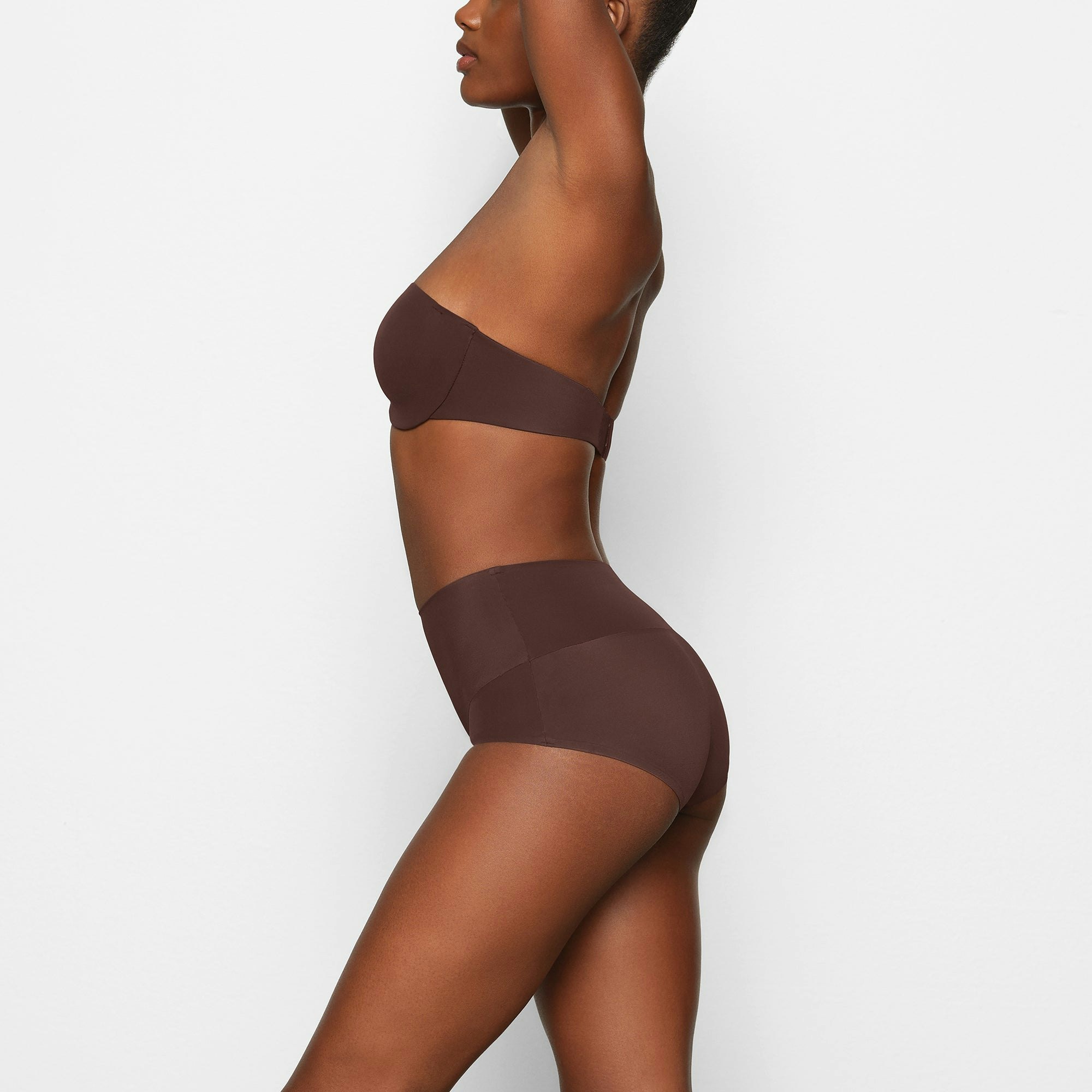 SMOOTHING HIGH WAIST BRIEF WORN BY A MODEL IN SIDE VIEW