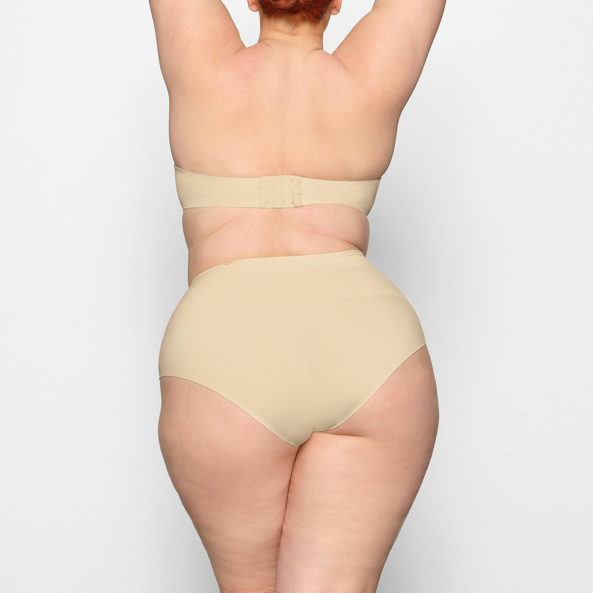 SMOOTHING HIGH WAIST BRIEF ON A MODEL BACK VIEW