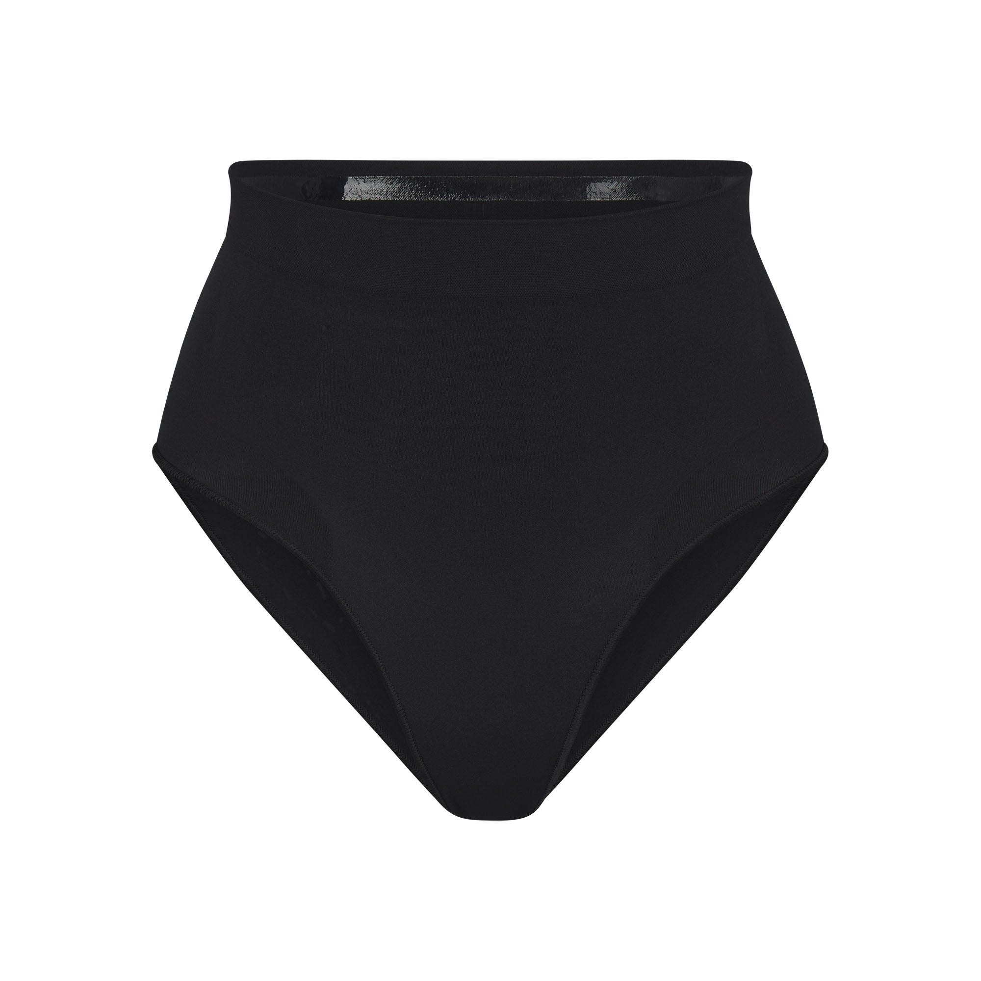 SEAMLESS SCULPT MID WAIST BRIEF | ONYX (SHAPEWEAR BRIEFS, PANTIES) LAYS FLAT ON A WHITE BACKGROUND | FLT