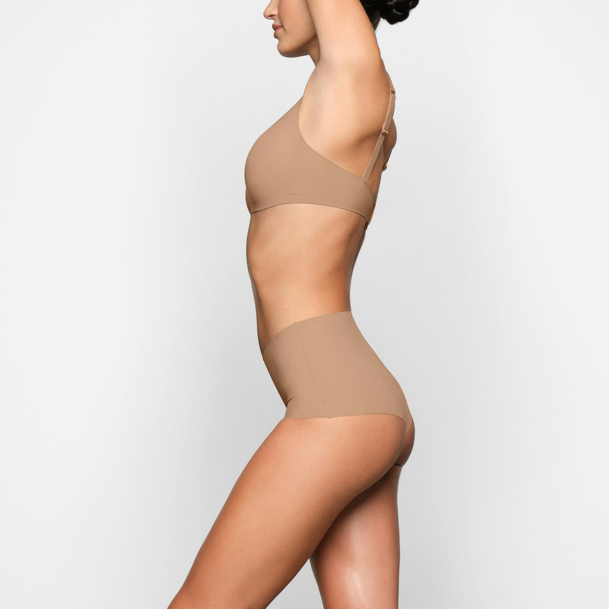 NAKED BOY SHORT WORN ON A MODEL IN SIDE VIEW