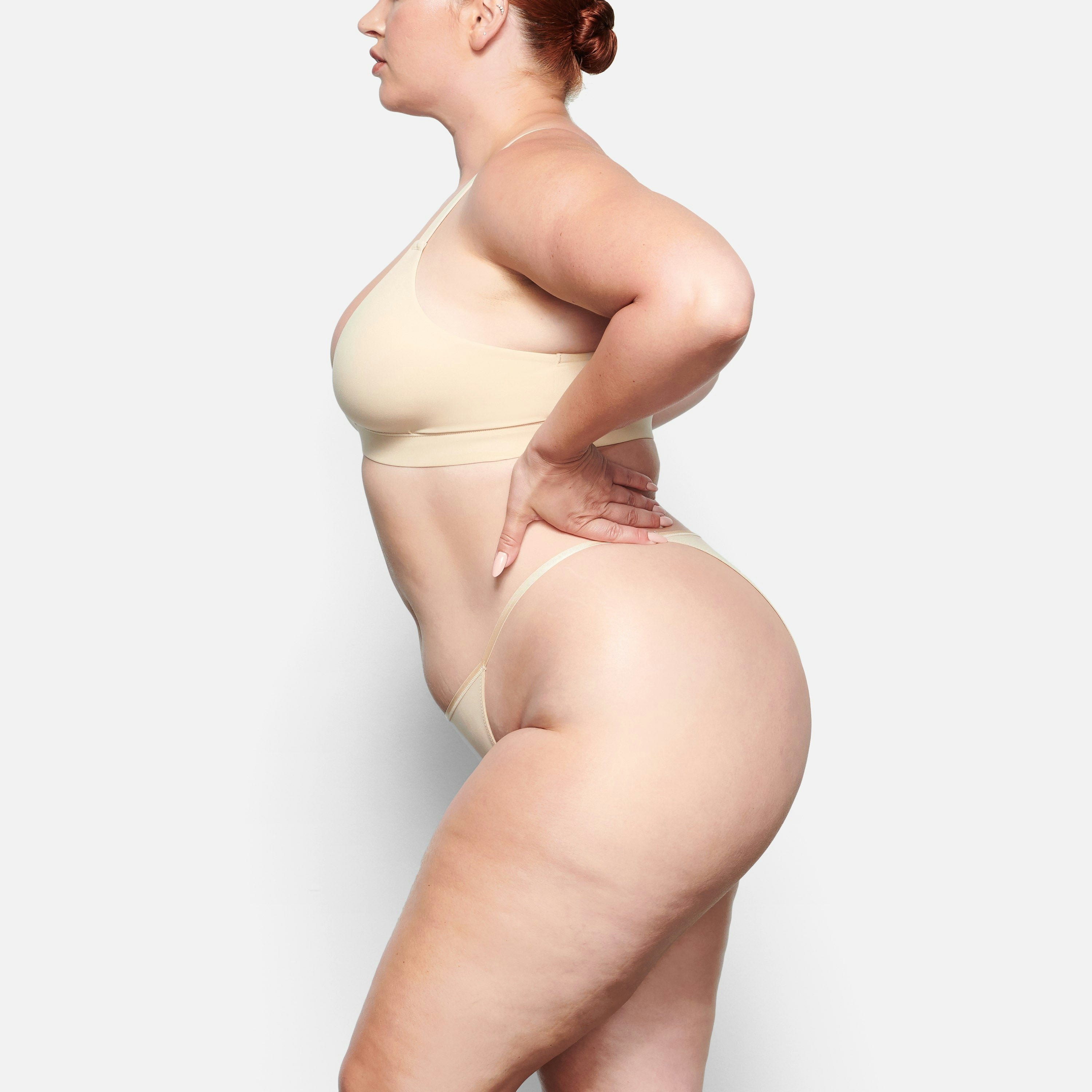 SIDE VIEW OF THE FITS EVERYBODY CHEEKY STRING BIKINI ON A MODEL