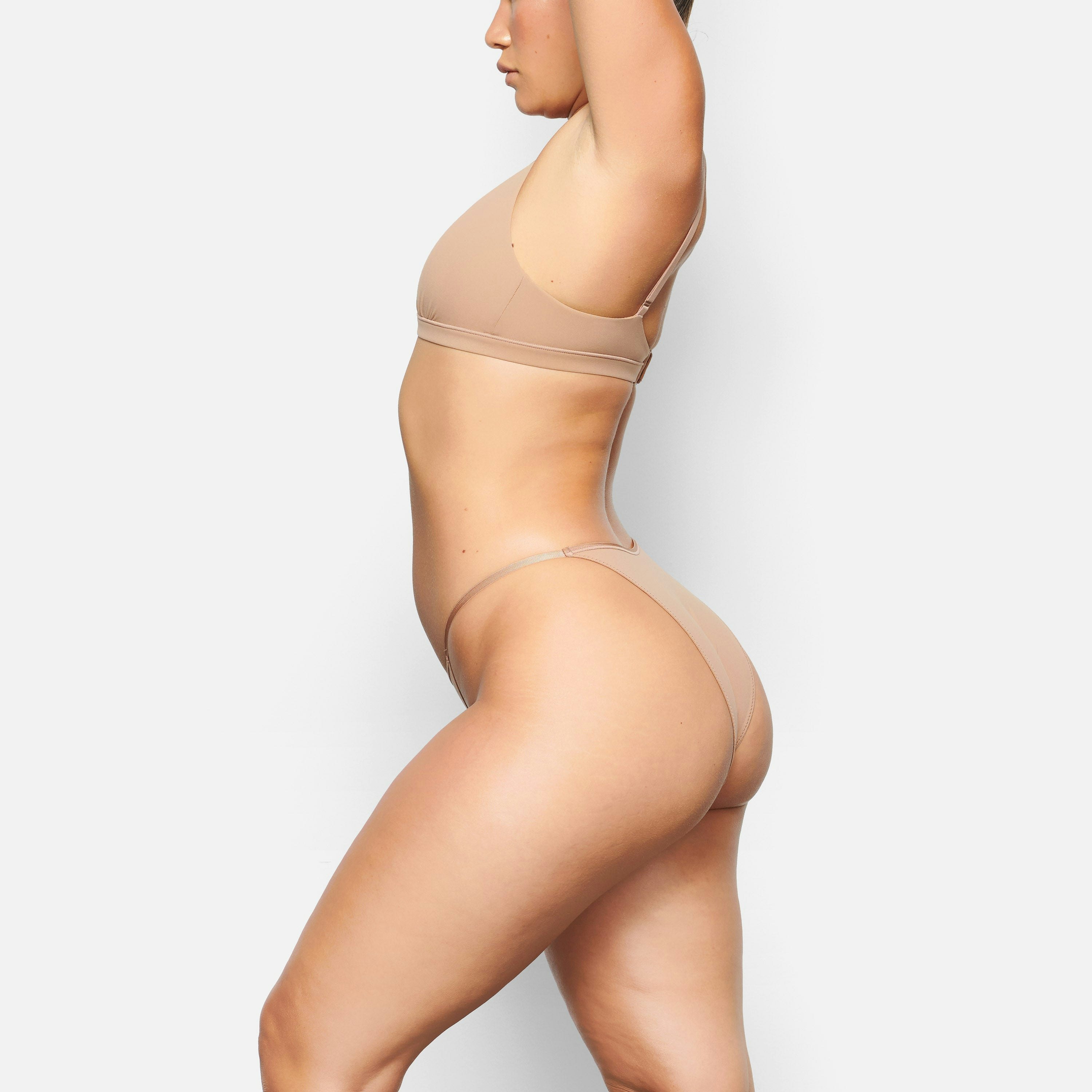 SIDE VIEW OF THE FITS EVERYBODY CHEEKY STRING BIKINI ON A MODEL