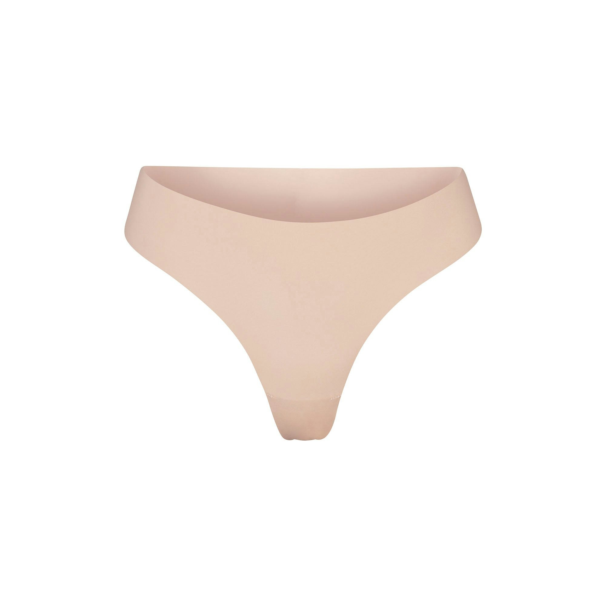 NAKED DIPPED THONG | MICA (THONGS, PANTIES) LAYS FLAT ON A WHITE BACKGROUND | FLT