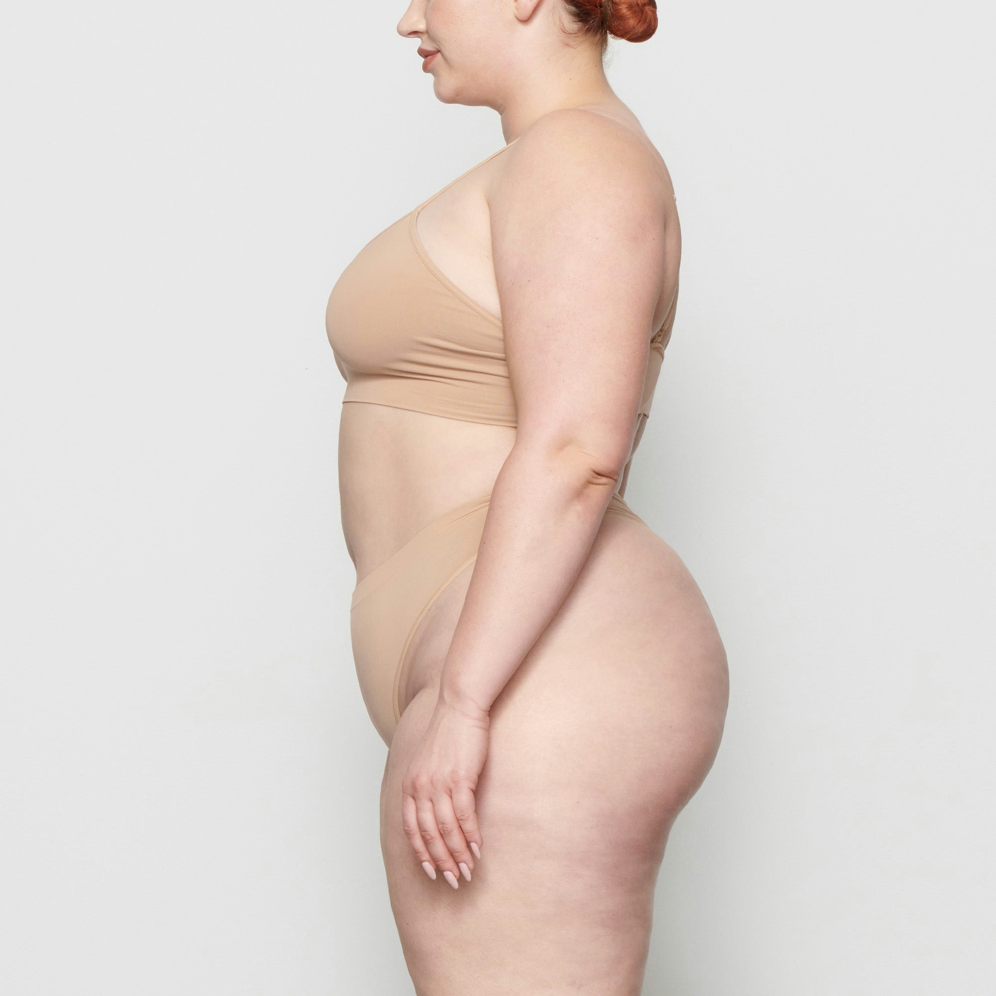 SOFT SMOOTHING THONG WORN BY A MODEL IN SIDE VIEW