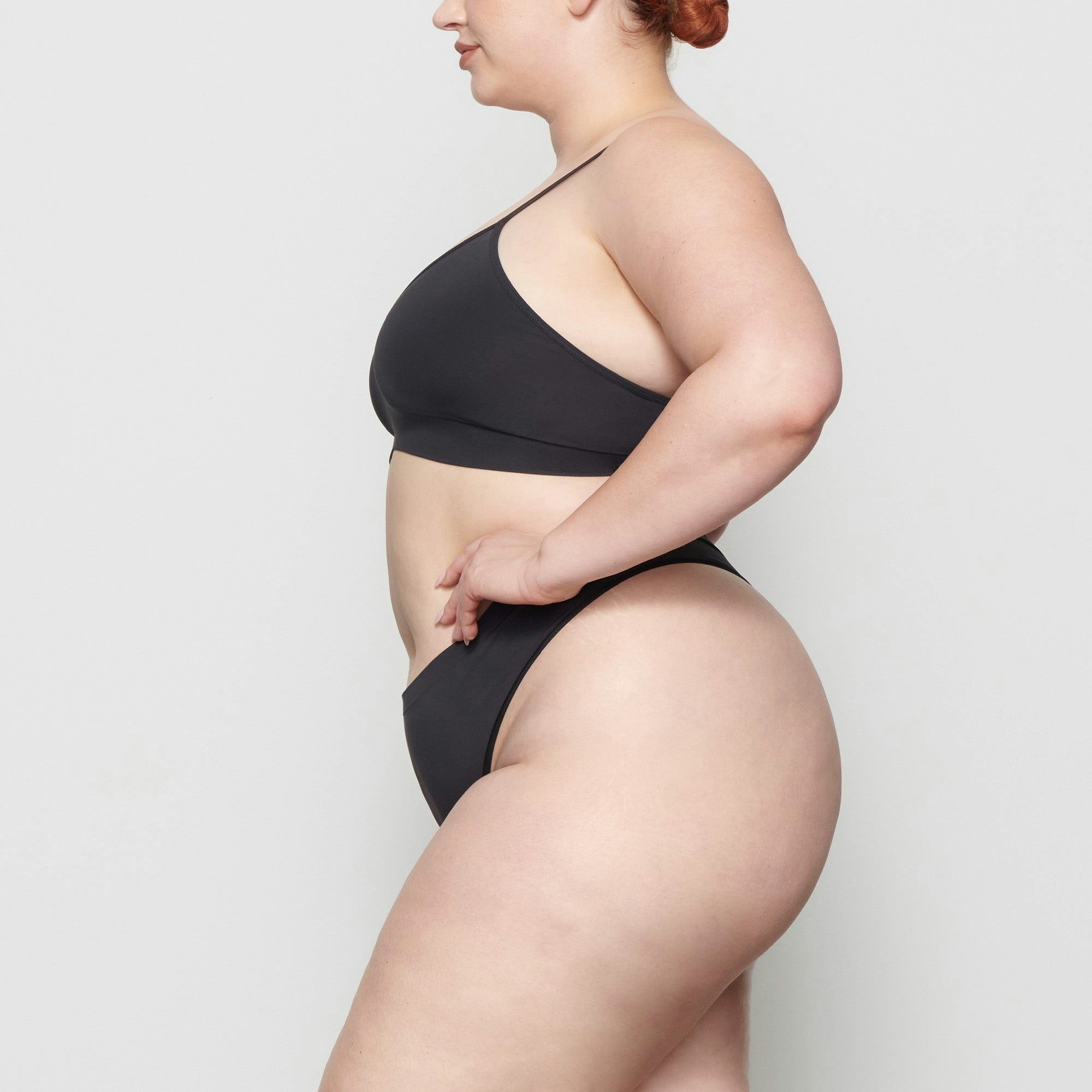 SOFT SMOOTHING THONG WORN BY A MODEL IN SIDE VIEW