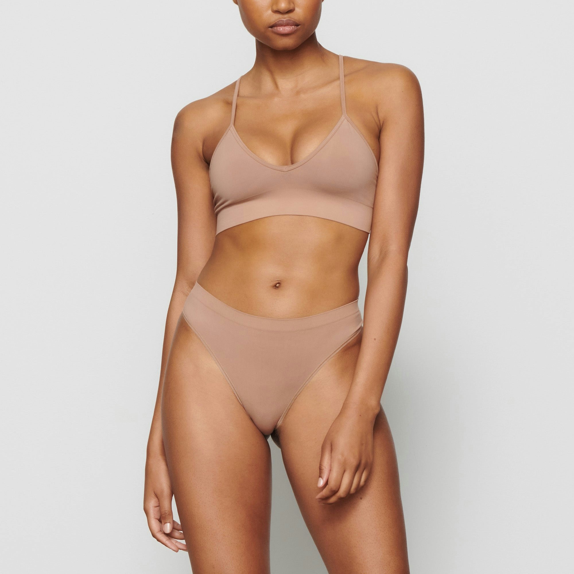 SOFT SMOOTHING THONG WORN BY A MODEL IN FRONT VIEW