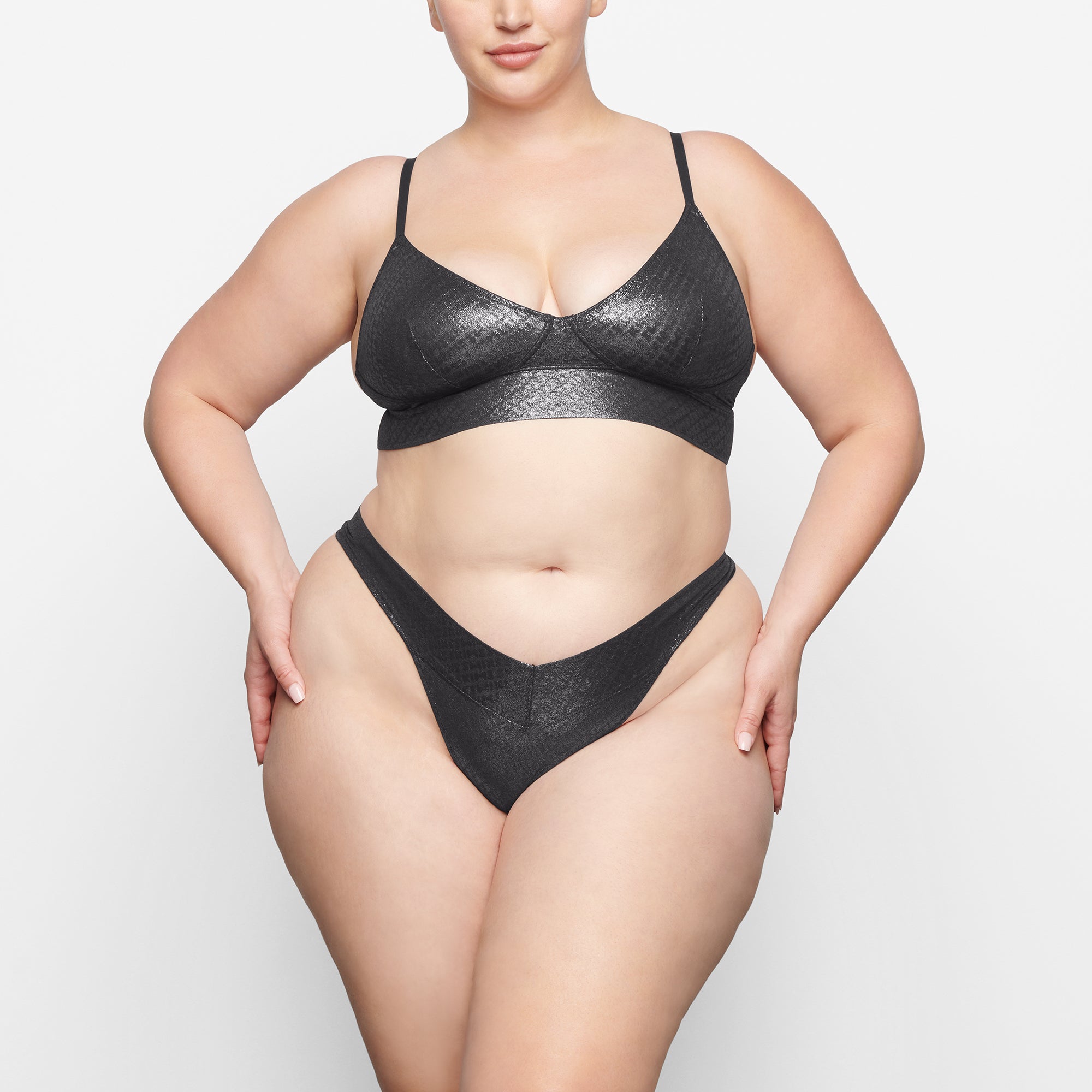 LOGO MESH FOIL TRIANGLE BRALETTE WORN BY A MODEL IN FRONT VIEW | SEE: 2X, 3X, 4X