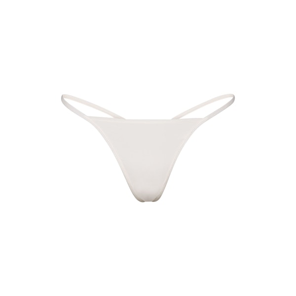FITS EVERYBODY T STRING THONG LAYS FLAT ON A WHITE BACKGROUND