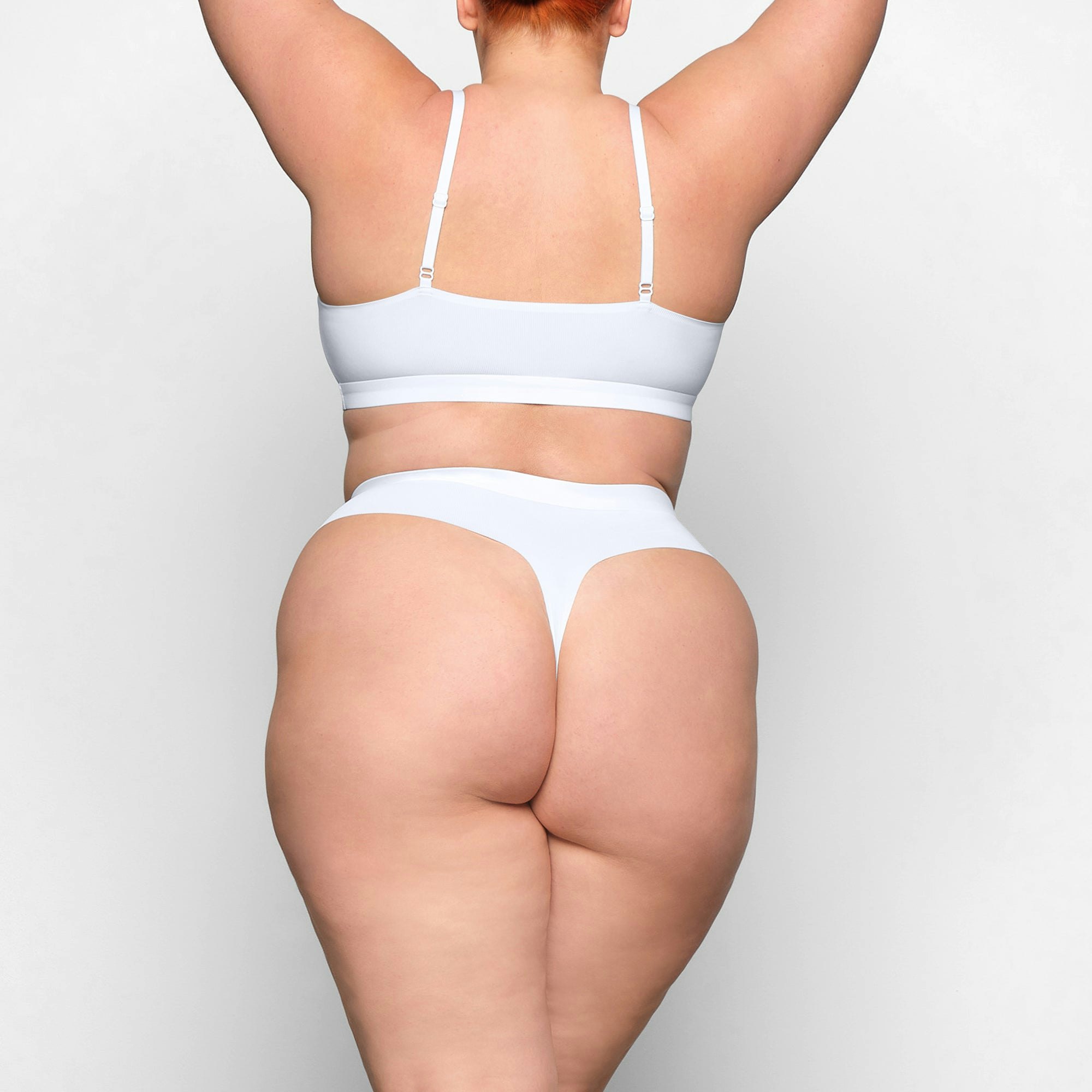 SMOOTH RIB THONG WORN BY A MODEL IN BACK VIEW