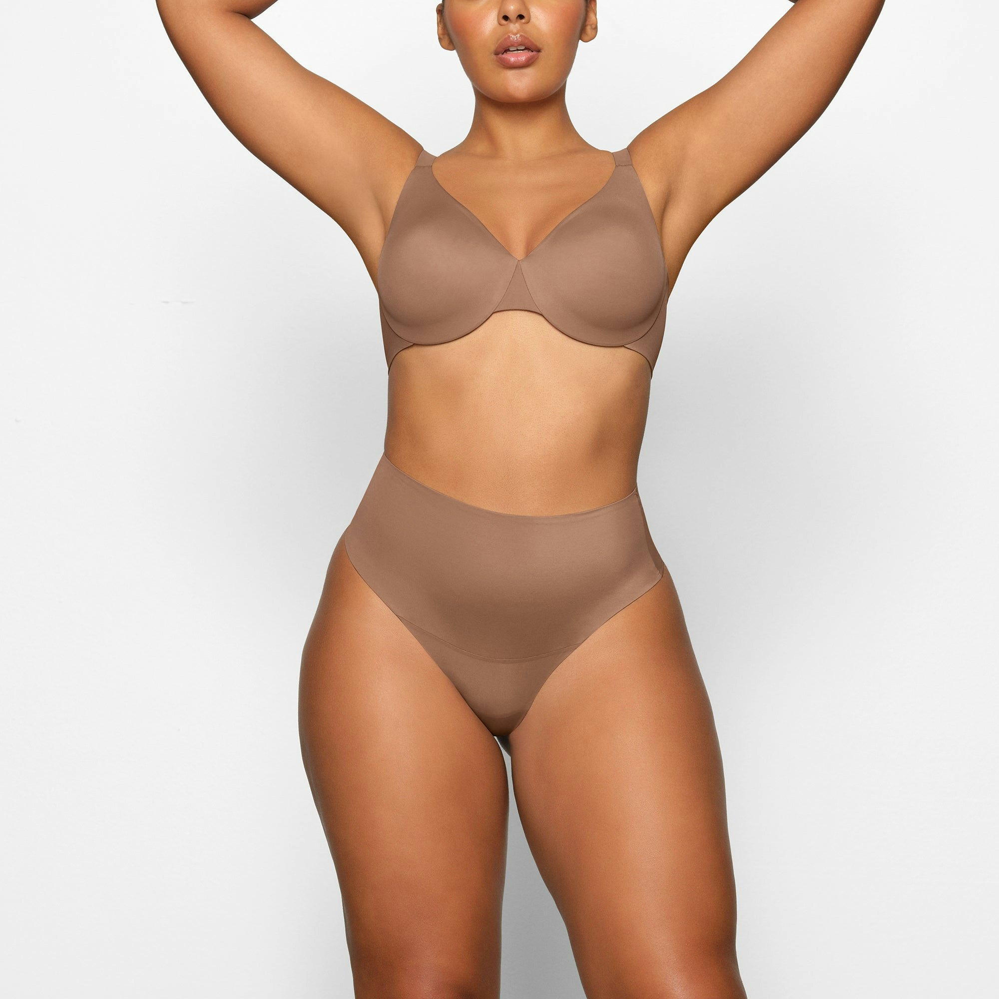 SMOOTHING HIGH WAIST THONG WORN BY A MODEL IN FRONT VIEW | SEE: M, L, XL