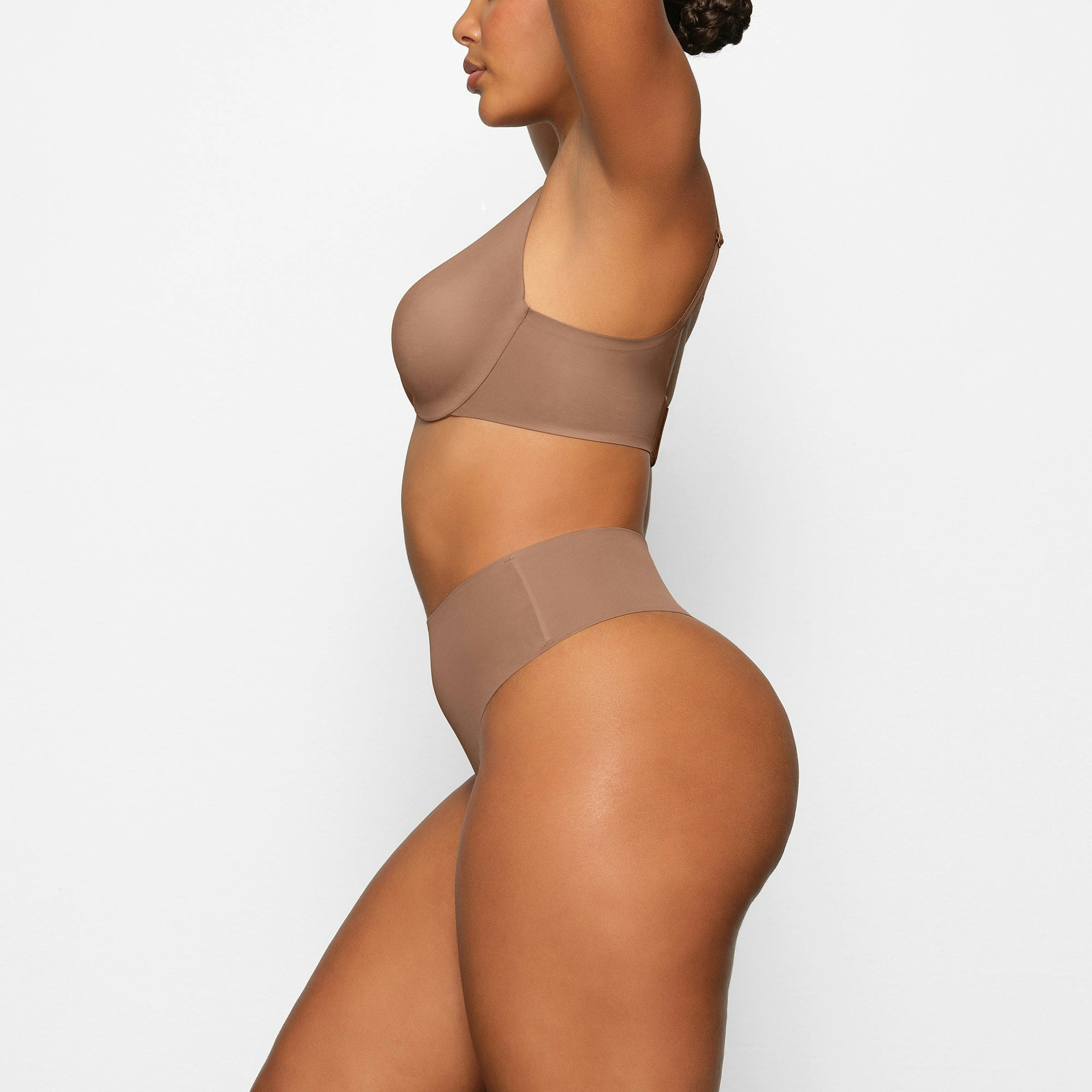 SMOOTHING HIGH WAIST THONG WORN BY A MODEL IN SIDE VIEW