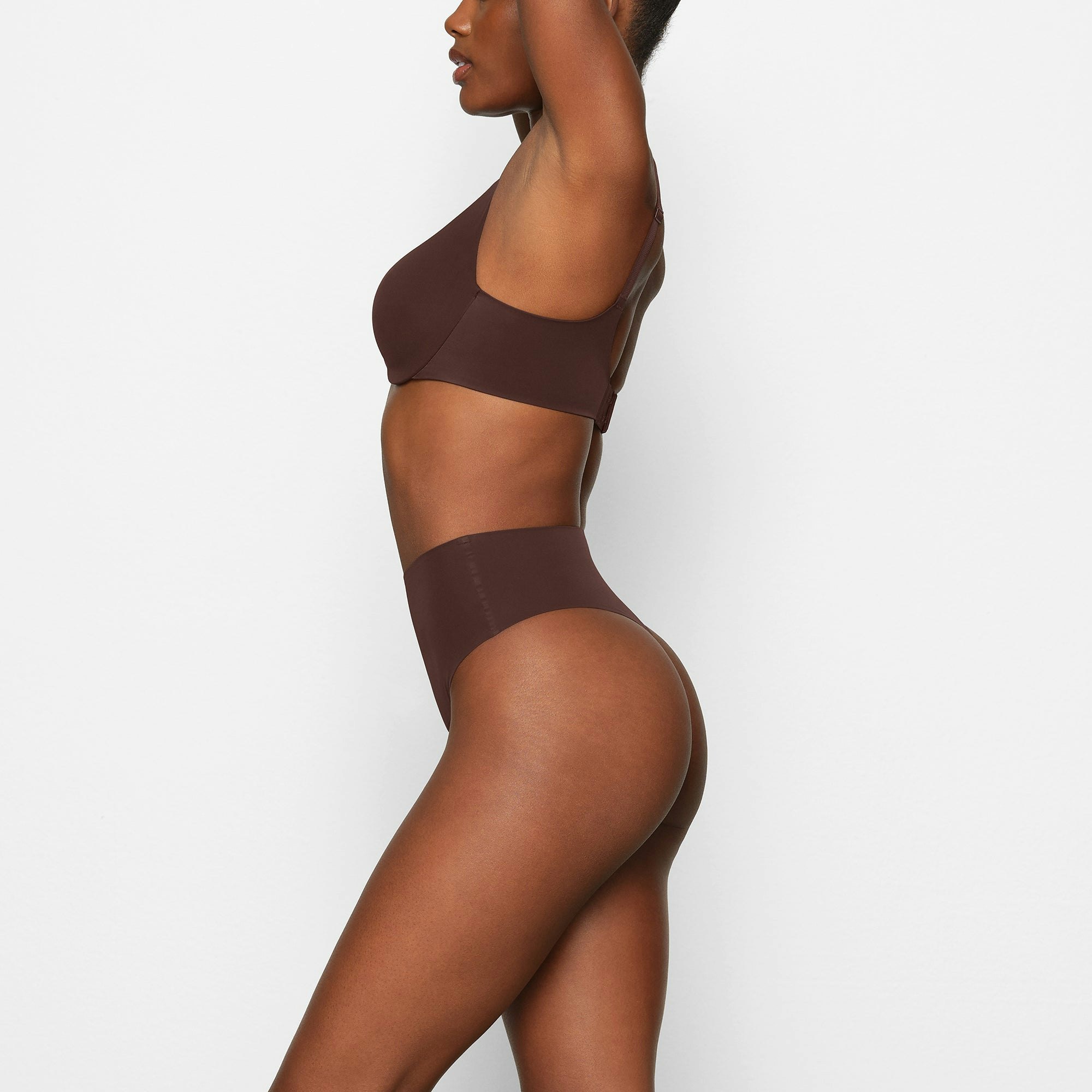 SMOOTHING HIGH WAIST THONG WORN BY A MODEL IN SIDE VIEW