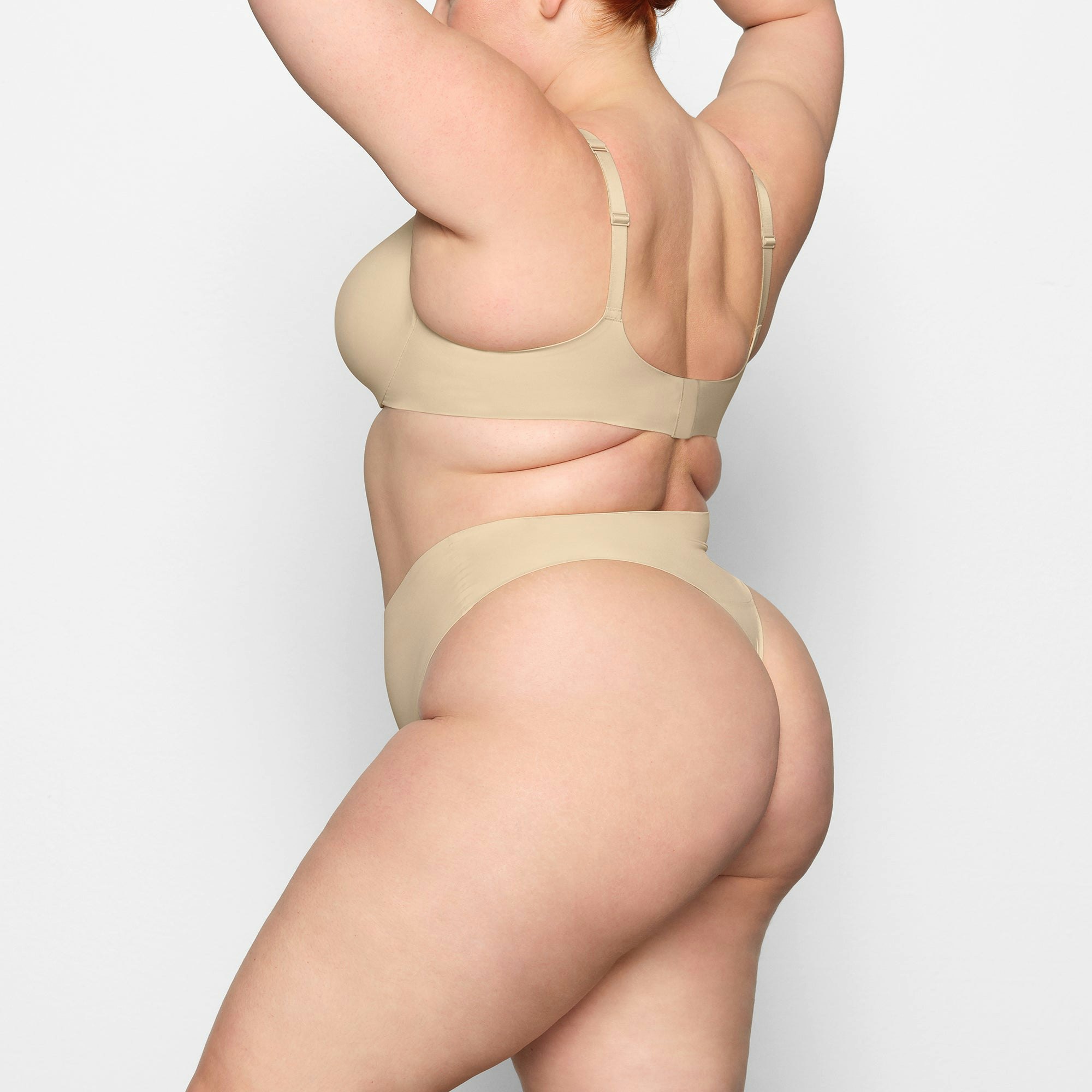 SMOOTHING HIGH WAIST THONG WORN BY A MODEL IN SIDE VIEW