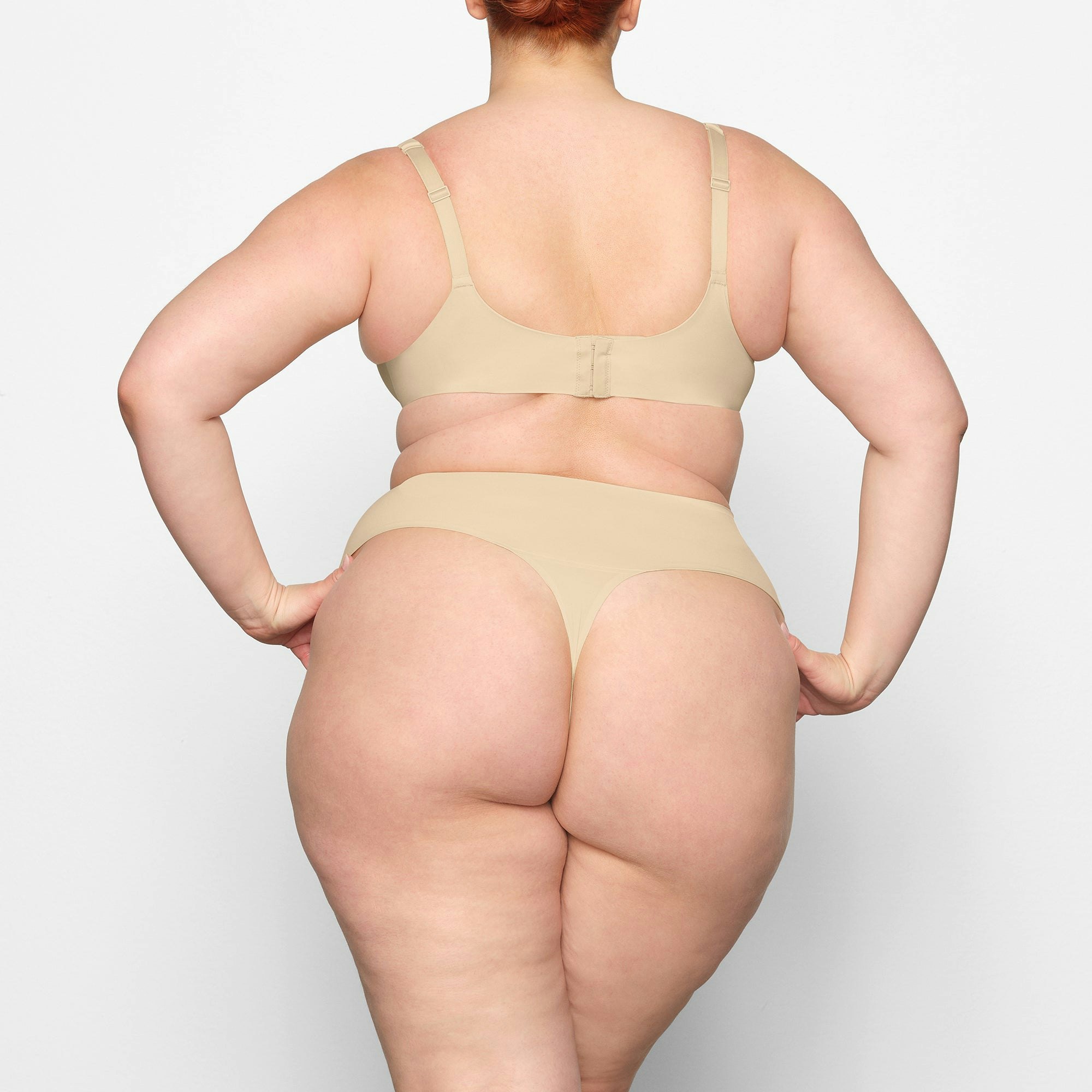 SMOOTHING HIGH WAIST THONG ON A MODEL BACK VIEW