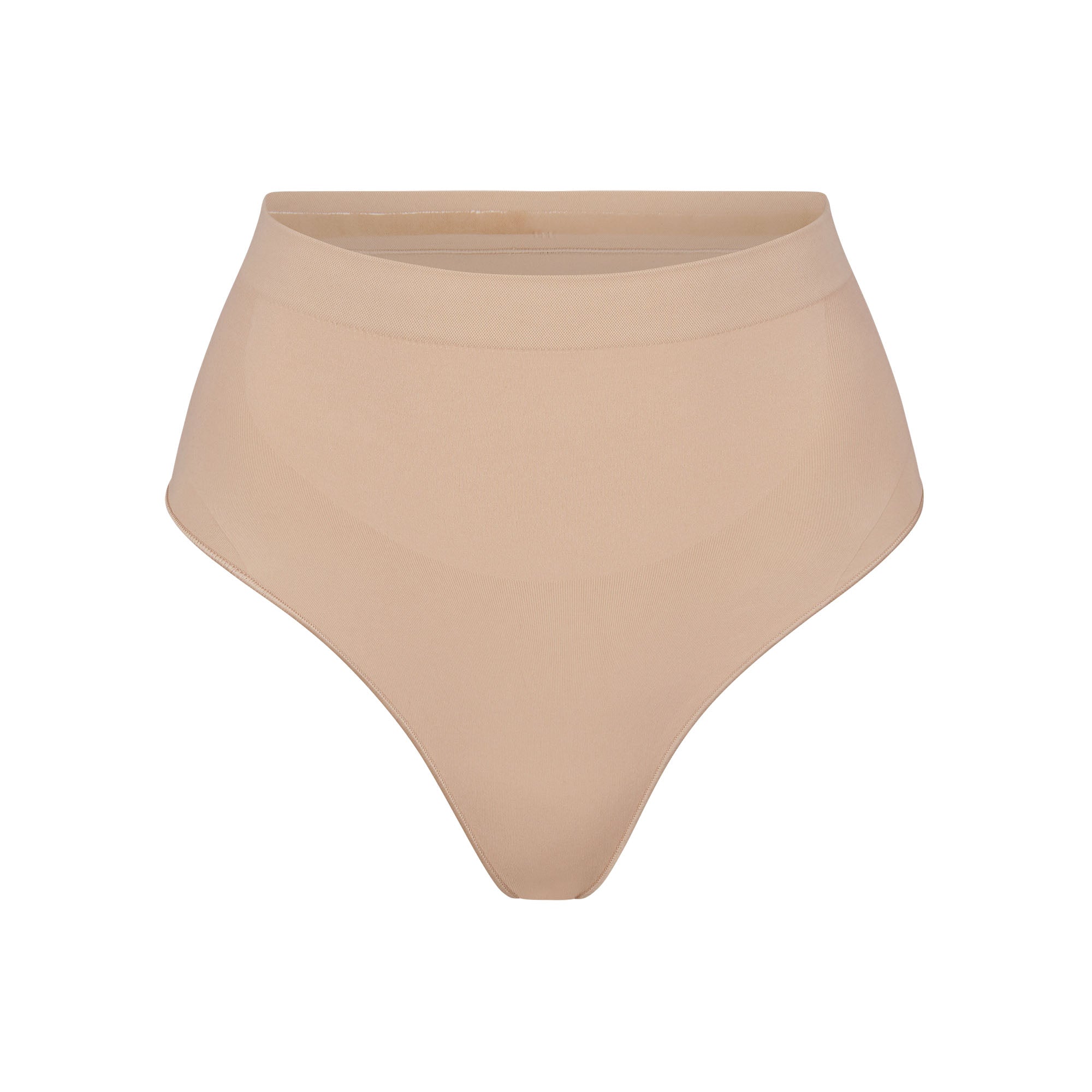 SEAMLESS SCULPT MID WAIST THONG | MICA (SHAPEWEAR THONGS, PANTIES) LAYS FLAT ON A WHITE BACKGROUND | FLT