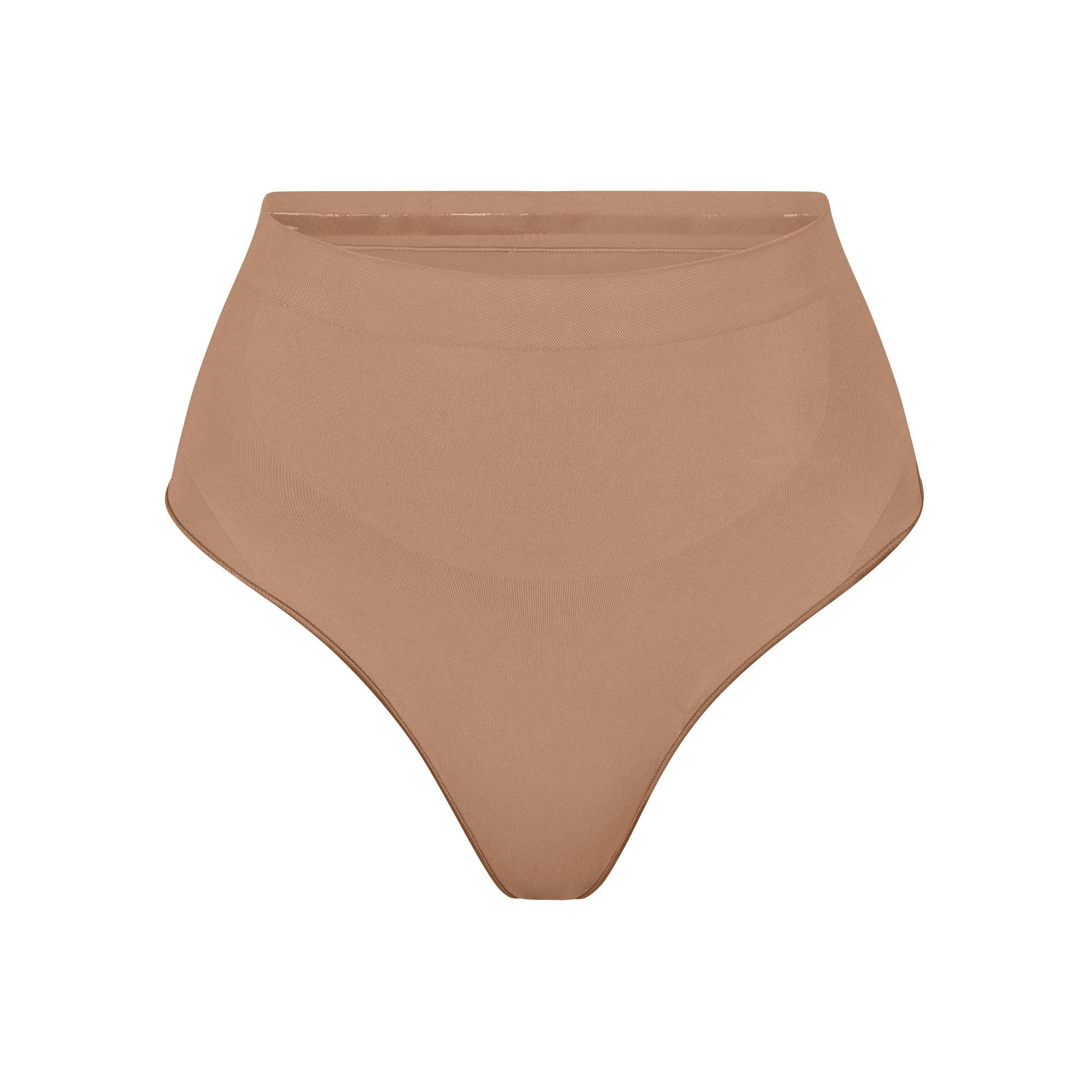 SEAMLESS SCULPT MID WAIST THONG | SIENNA (SHAPEWEAR THONGS, SHAPEWEAR) LAYS FLAT ON A WHITE BACKGROUND | FLT