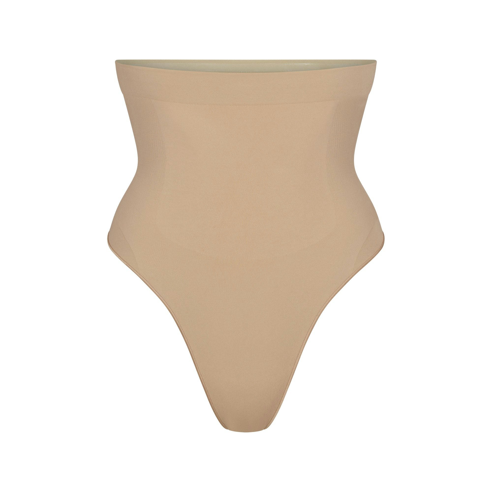SEAMLESS SCULPT HIGH-WAISTED THONG | CLAY (SHAPEWEAR THONGS, PANTIES) LAYS FLAT ON A WHITE BACKGROUND | FLT