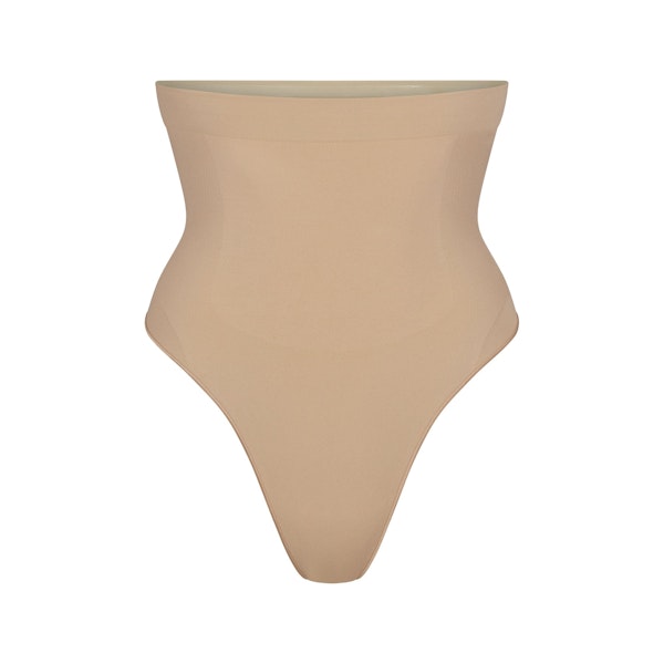 SEAMLESS SCULPT HIGH-WAISTED THONG | CLAY (SHAPEWEAR THONGS, PANTIES) LAYS FLAT ON A WHITE BACKGROUND | FLT