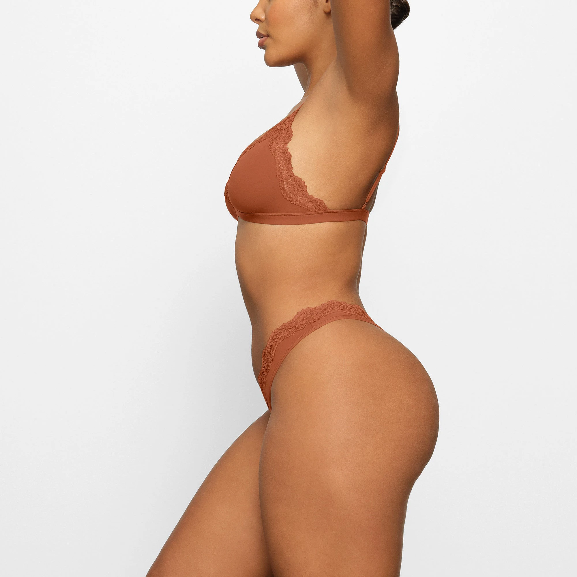 FITS EVERYBODY LACE DIPPED THONG WORN BY A MODEL IN SIDE VIEW