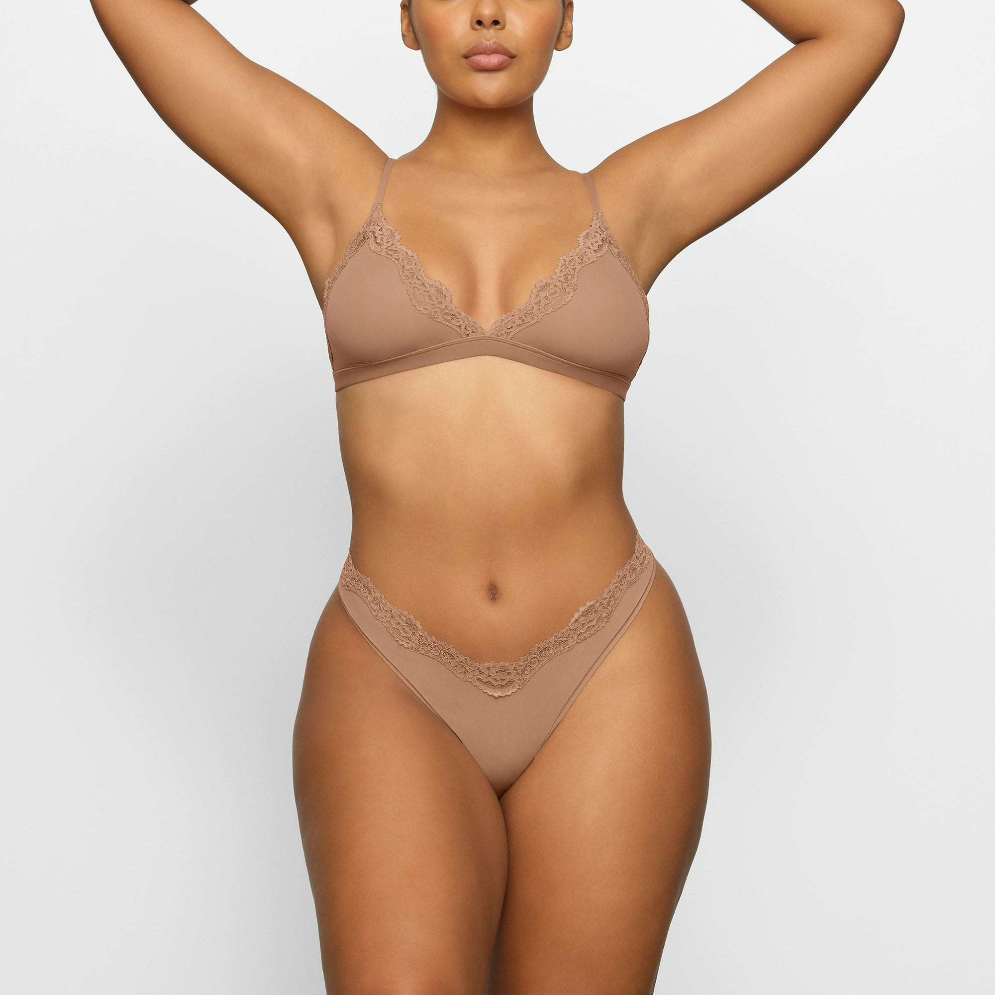 FITS EVERYBODY LACE DIPPED THONG WORN BY A MODEL IN FRONT VIEW | SEE: M, L, XL