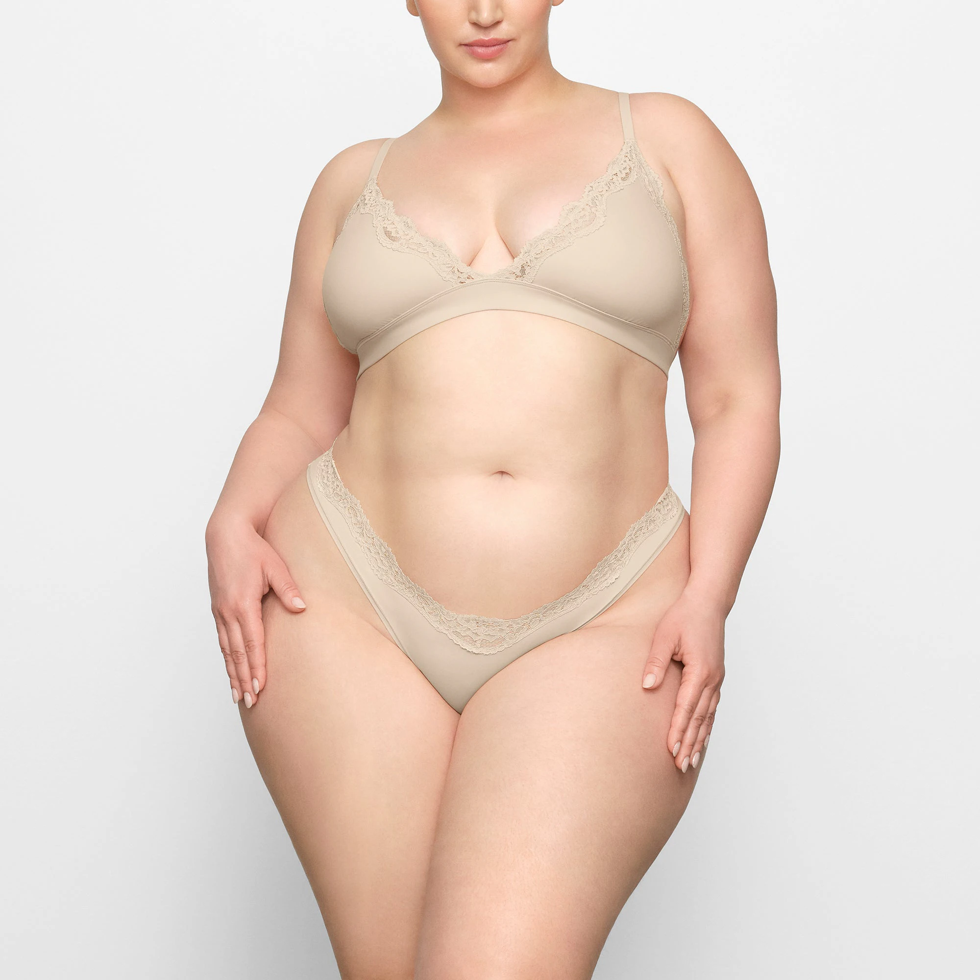 FITS EVERYBODY LACE DIPPED THONG WORN BY A MODEL IN FRONT VIEW | SEE: 2X, 3X, 4X