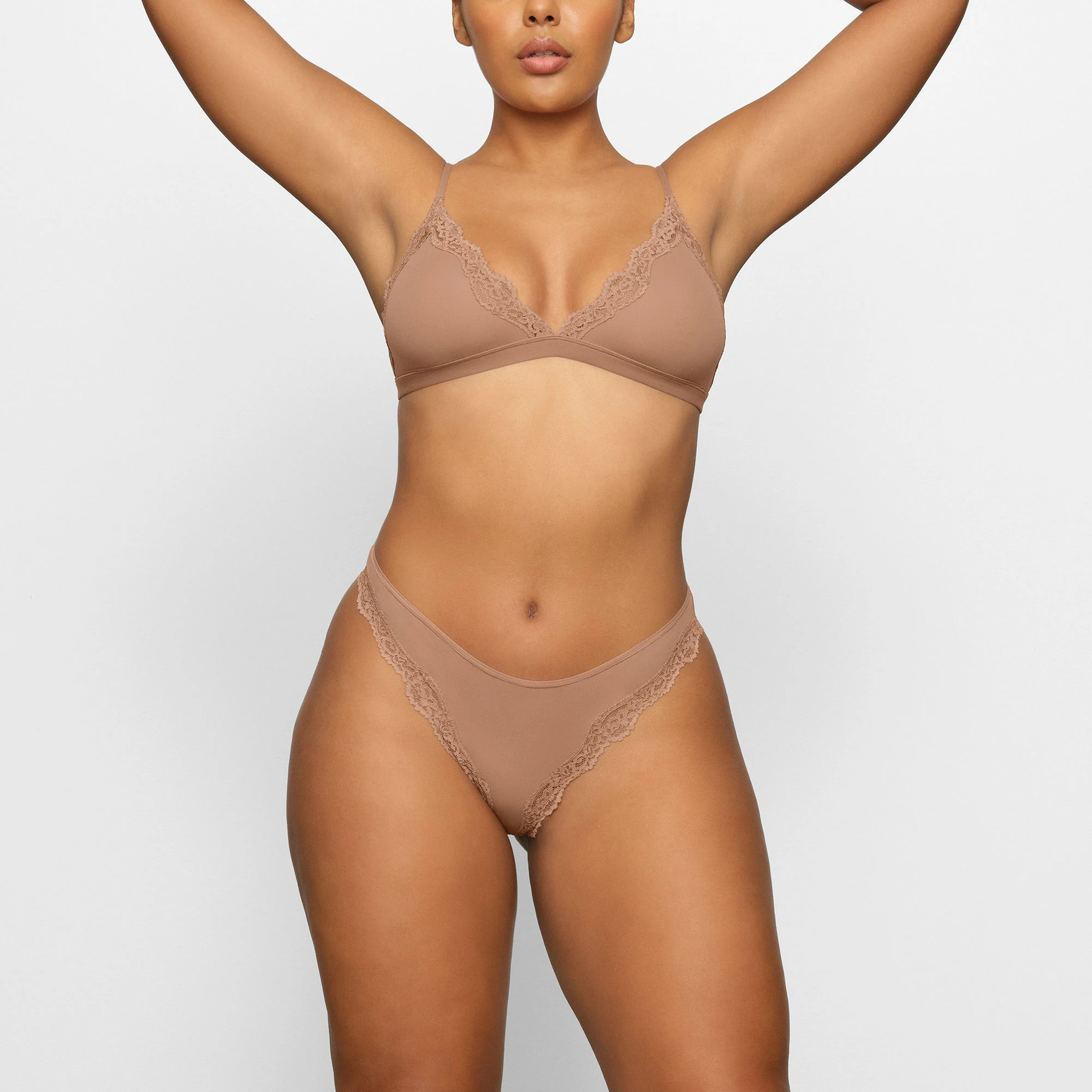 FITS EVERYBODY LACE TANGA WORN BY A MODEL IN FRONT VIEW | SEE: M, L, XL