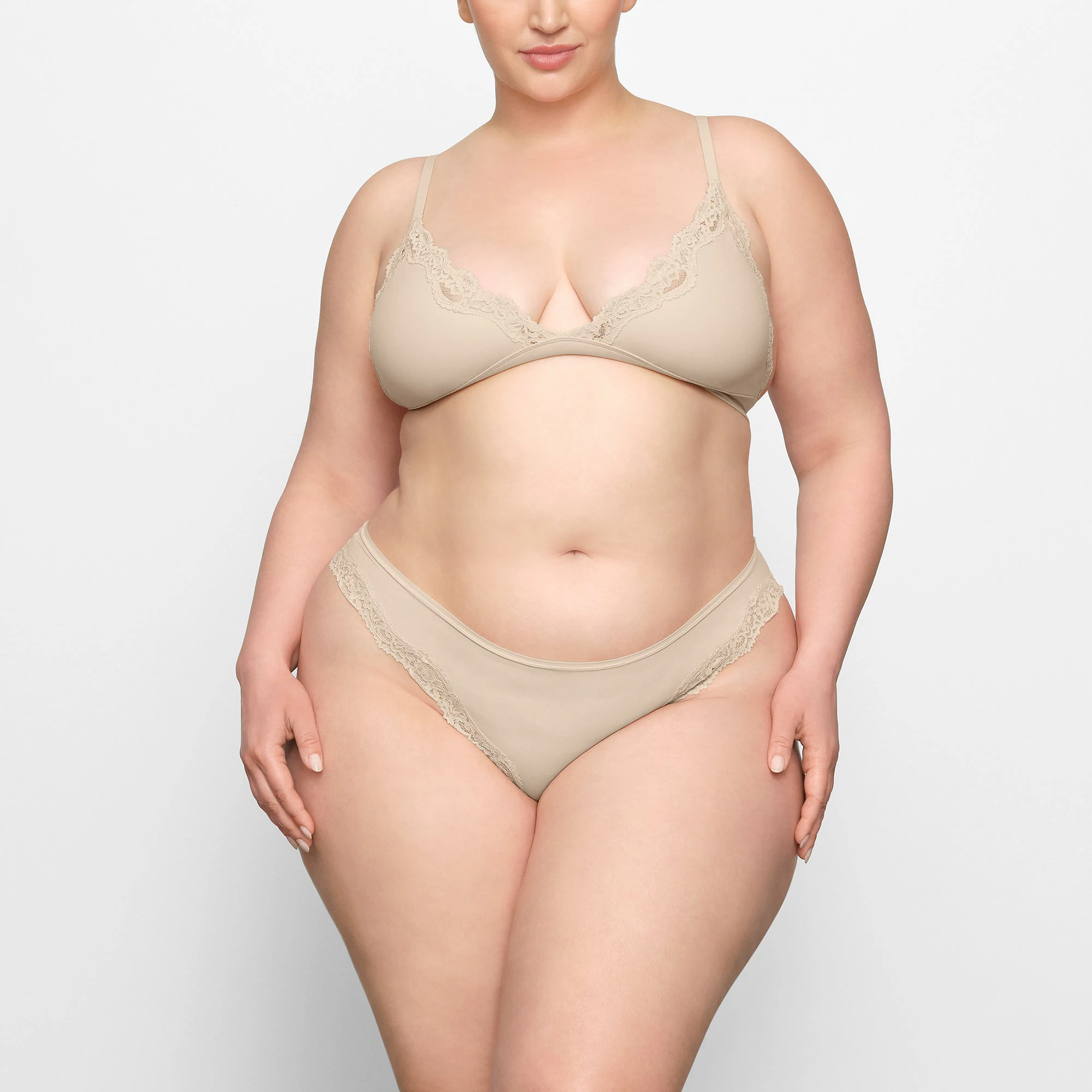 FITS EVERYBODY LACE TANGA WORN BY A MODEL IN FRONT VIEW | SEE: 2X, 3X, 4X