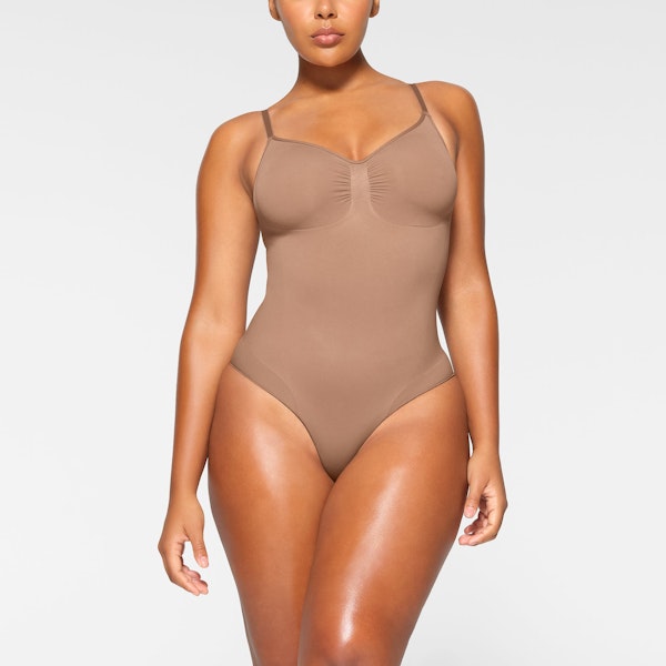 SEAMLESS SCULPT BRIEF BODYSUIT WORN BY A MODEL IN FRONT VIEW | SEE: M, L, XL