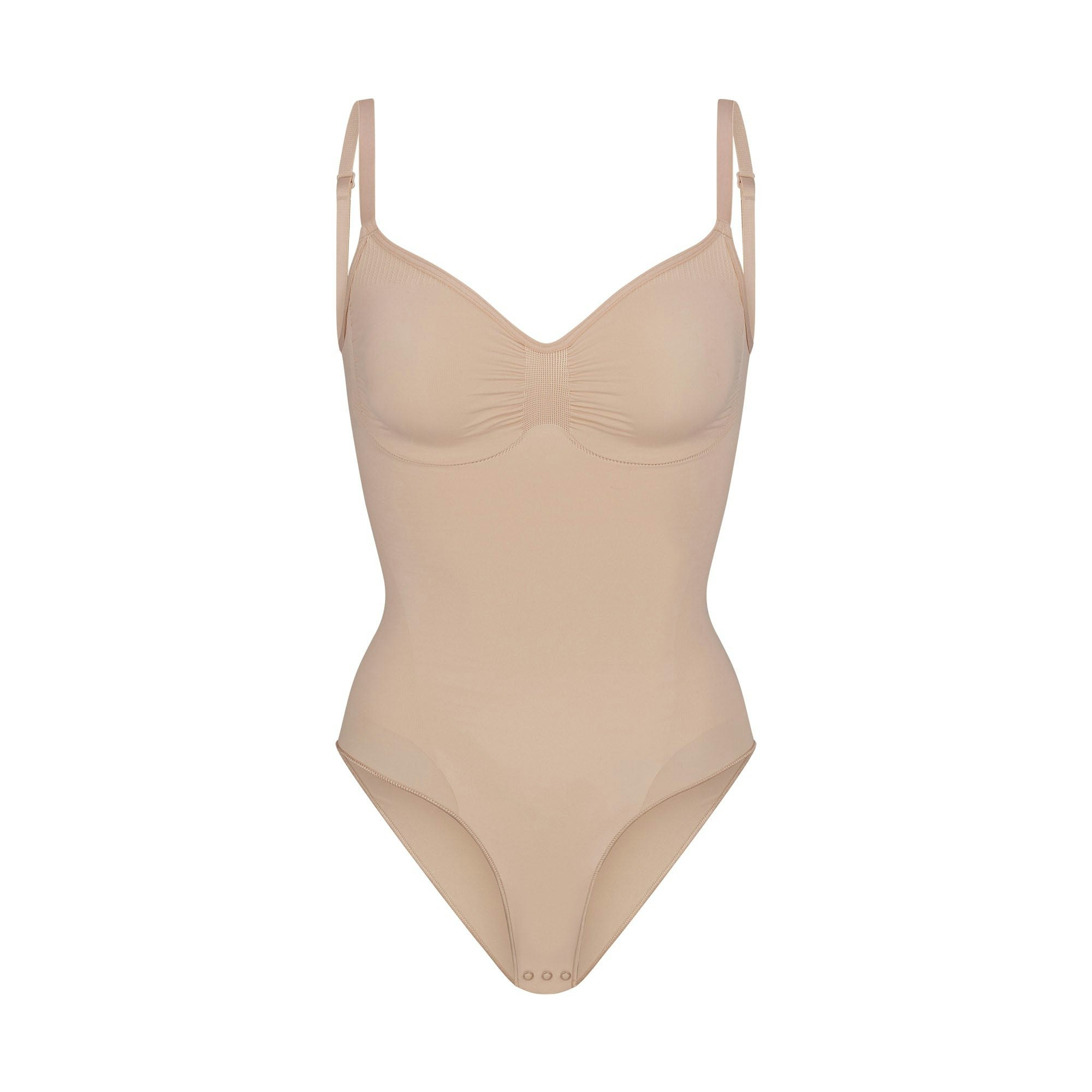 SEAMLESS SCULPT BRIEF BODYSUIT | MICA (SHAPEWEAR BODYSUITS) LAYS FLAT ON A WHITE BACKGROUND | FLT