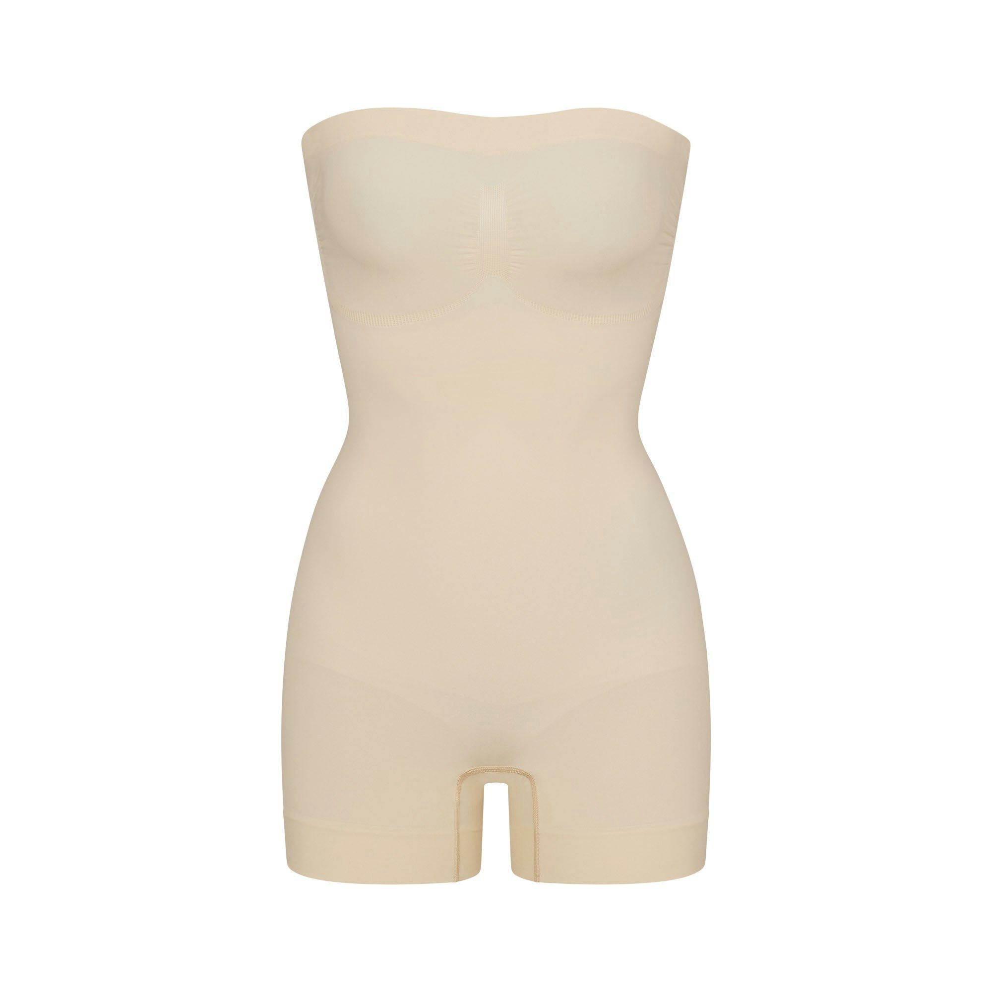 SEAMLESS SCULPT STRAPLESS SHORTIE BODYSUIT | SAND (ONESIES, BODYSUITS) LAYS FLAT ON A WHITE BACKGROUND | FLT
