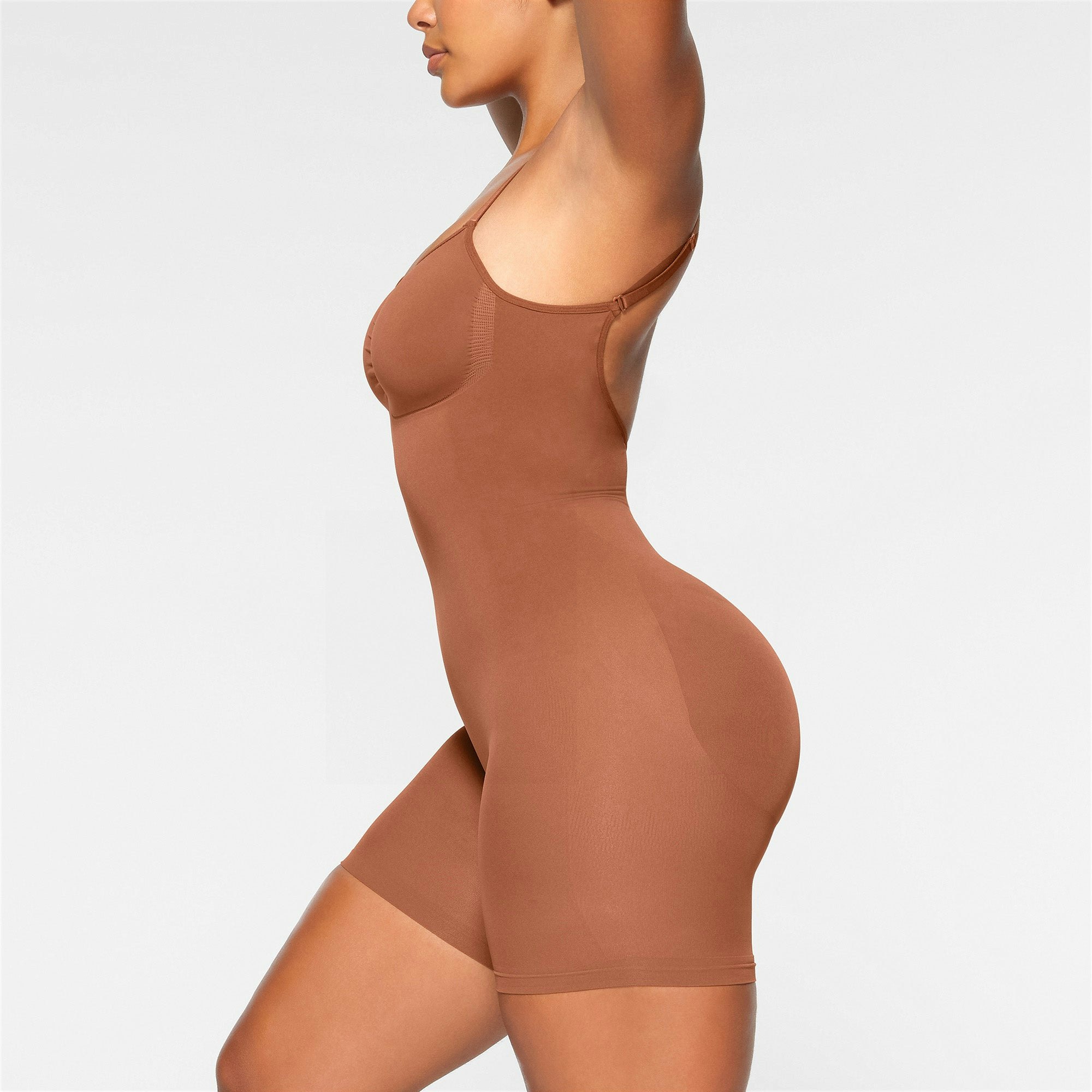SEAMLESS SCULPT LOW BACK MID THIGH BODYSUIT ON A MODEL BACK VIEW