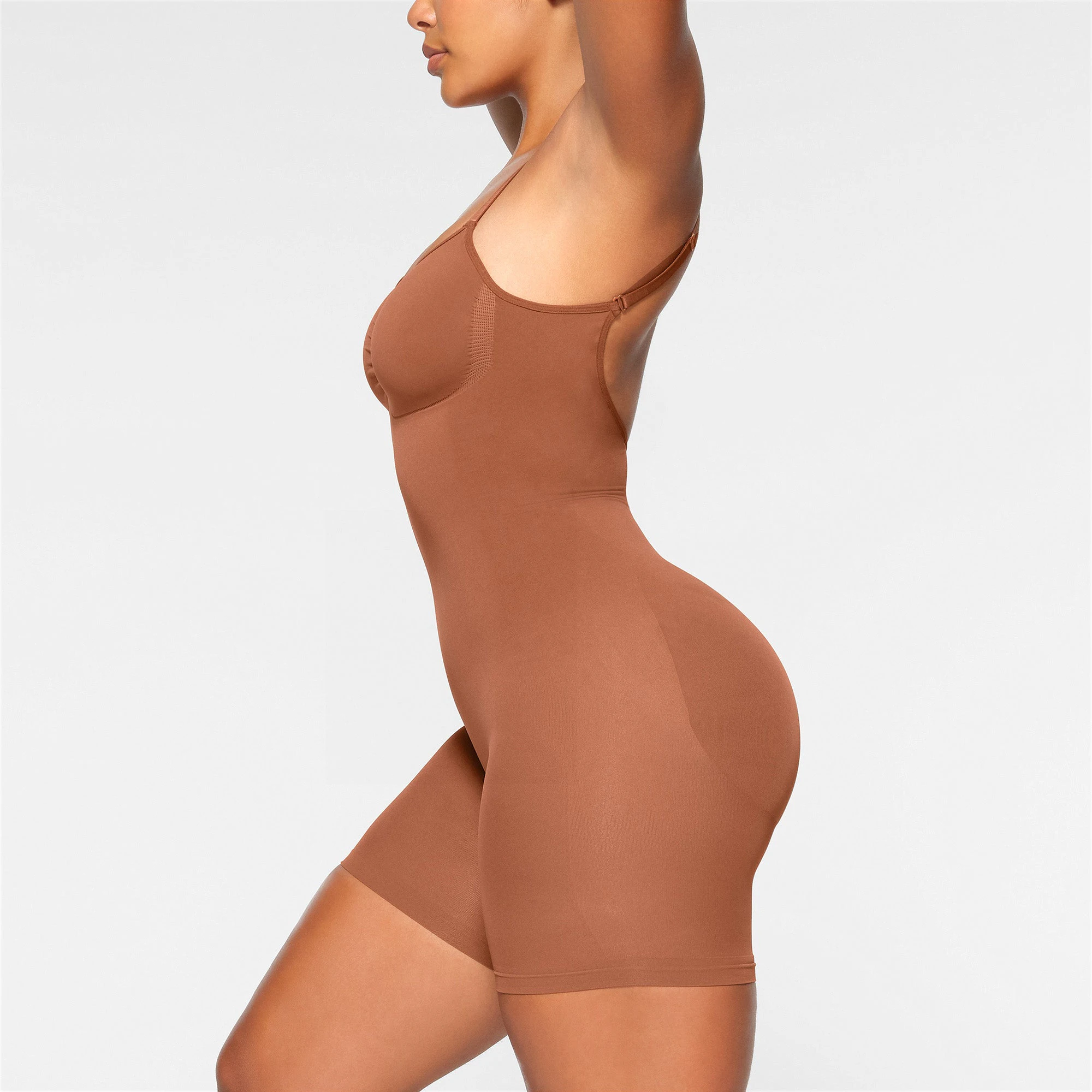 SEAMLESS SCULPT LOW BACK MID THIGH BODYSUIT ON A MODEL BACK VIEW