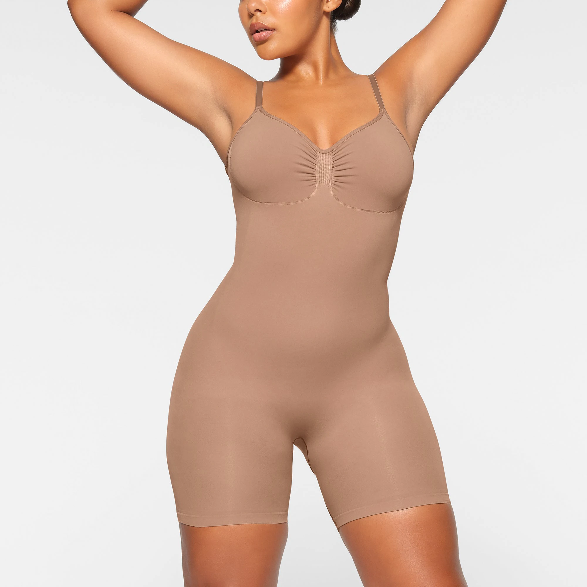 SEAMLESS SCULPT LOW BACK MID THIGH BODYSUIT WORN BY A MODEL IN FRONT VIEW, XL